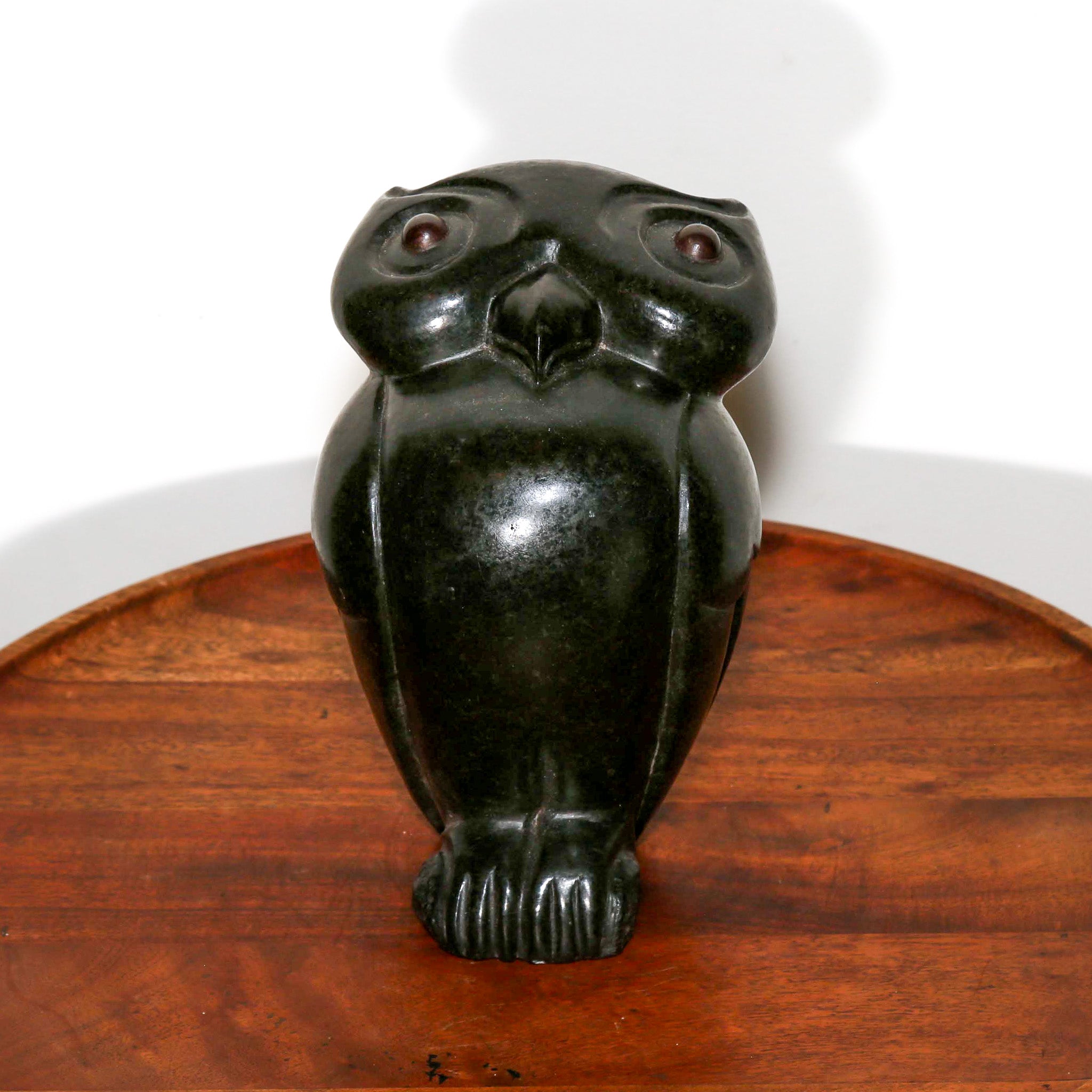 "Observant Owl" Sculpture Carved in Black Stone on a table