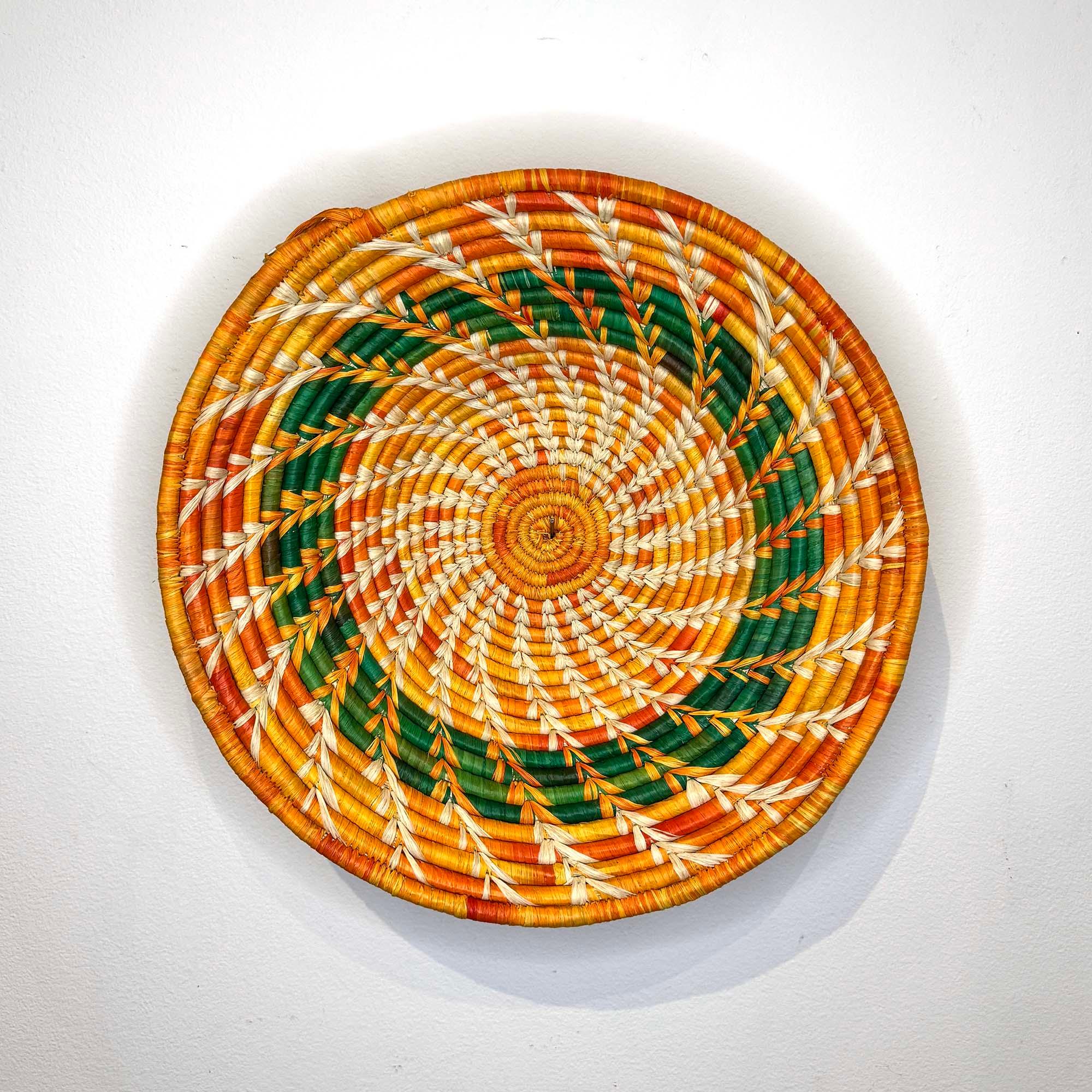 Orange-Green Woven Basket Handmade in Uganda as a wall decor