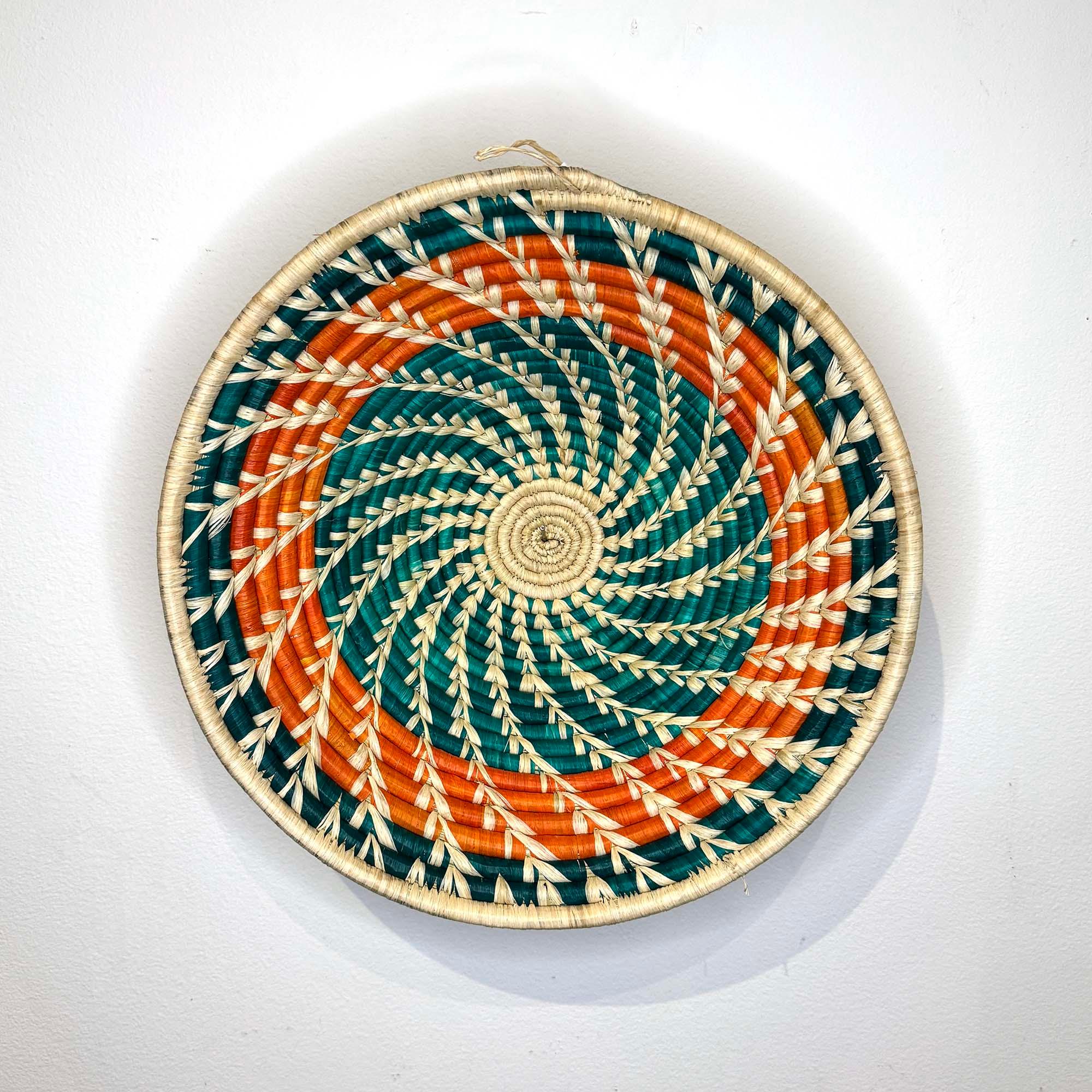 Orange-Teal Woven Basket from Uganda as a wall decor idea