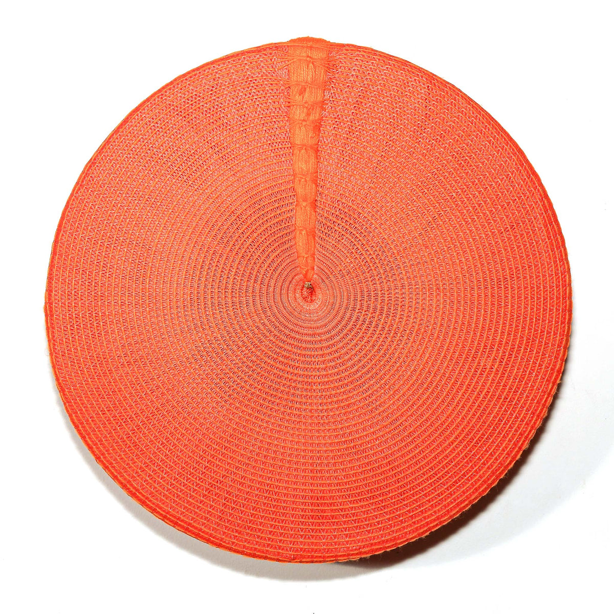 Bright orange Zulu hat from South Africa with a rounded woven form, displayed as colorful African wall decor