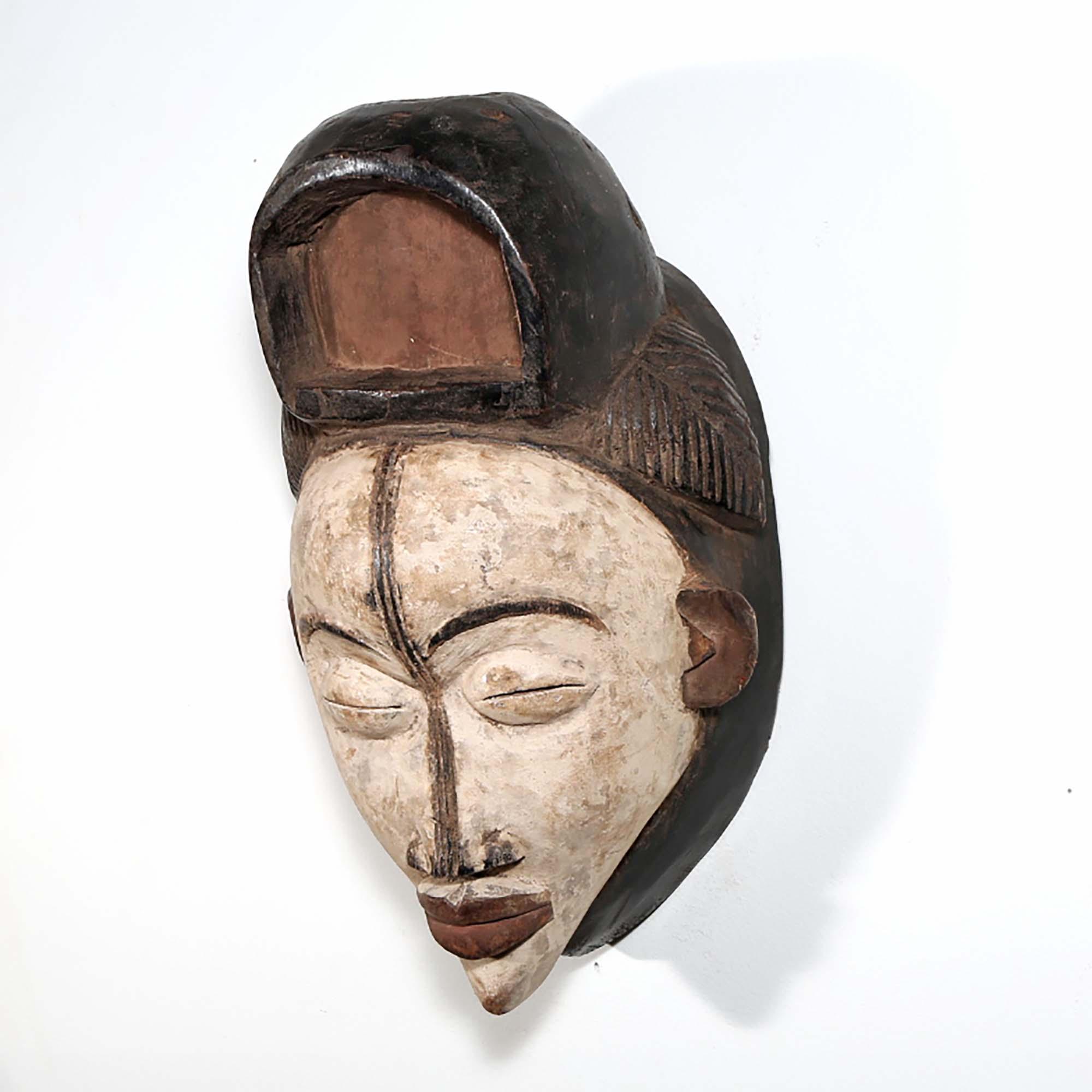 Punu Mask from Gabon as African mask wall decor idea left side