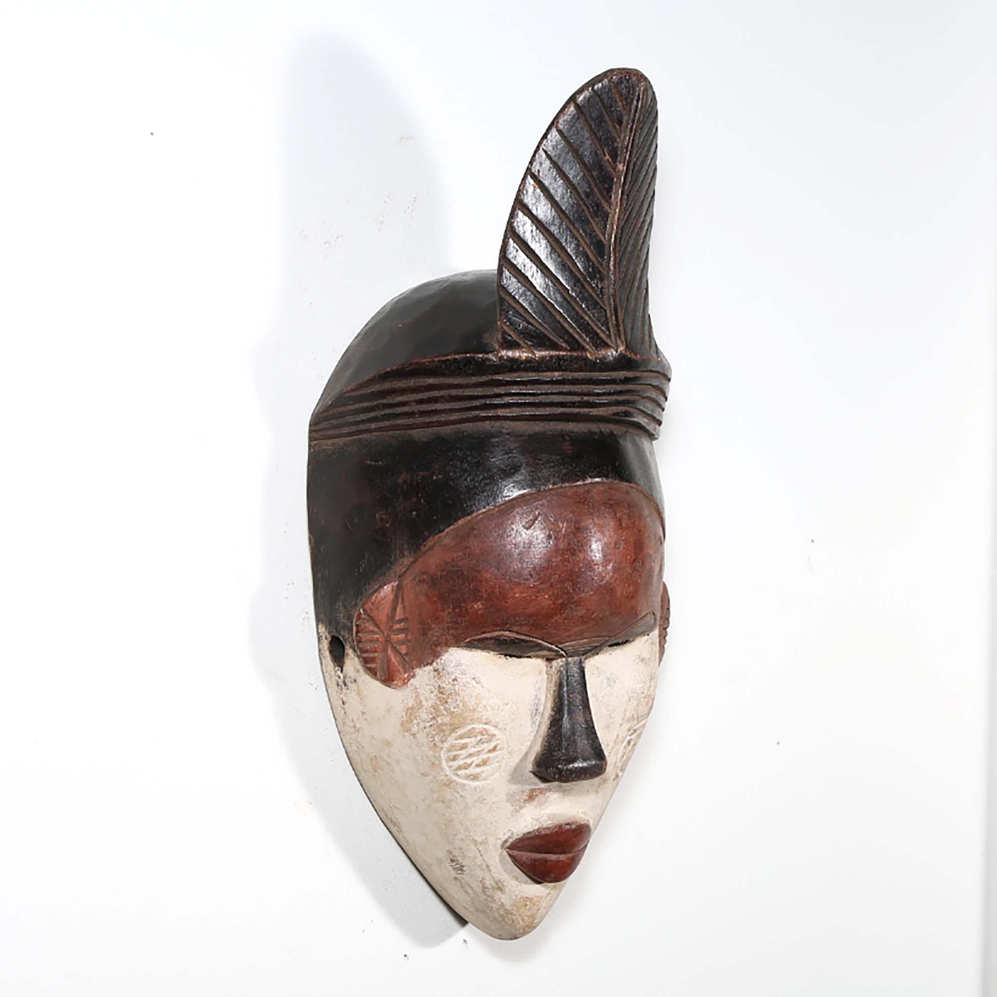 Punu Style African Mask from Gabon as a wall decoration right side