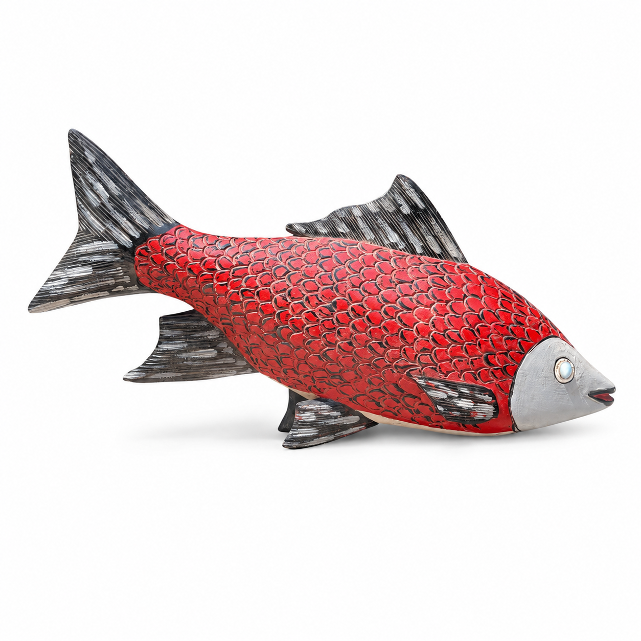 Red fish hand carved wood African sculpture on a white background