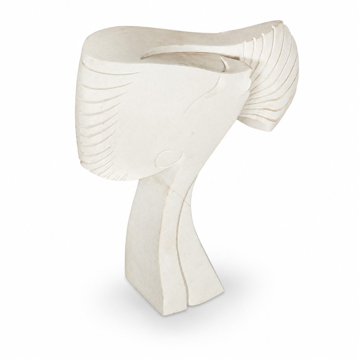 White stone abstract sculpture of a woman's face with hair blowing in the wind on a white background