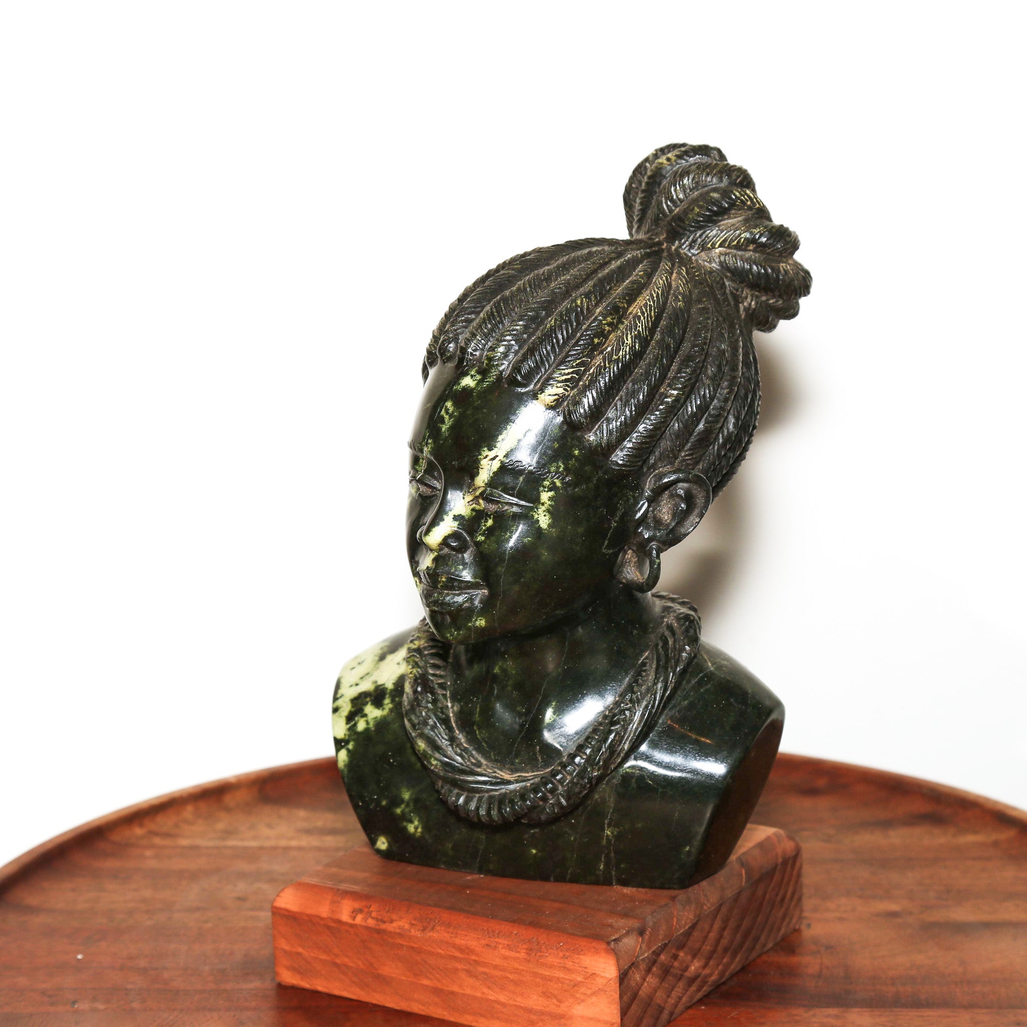 small sculpture of an African woman