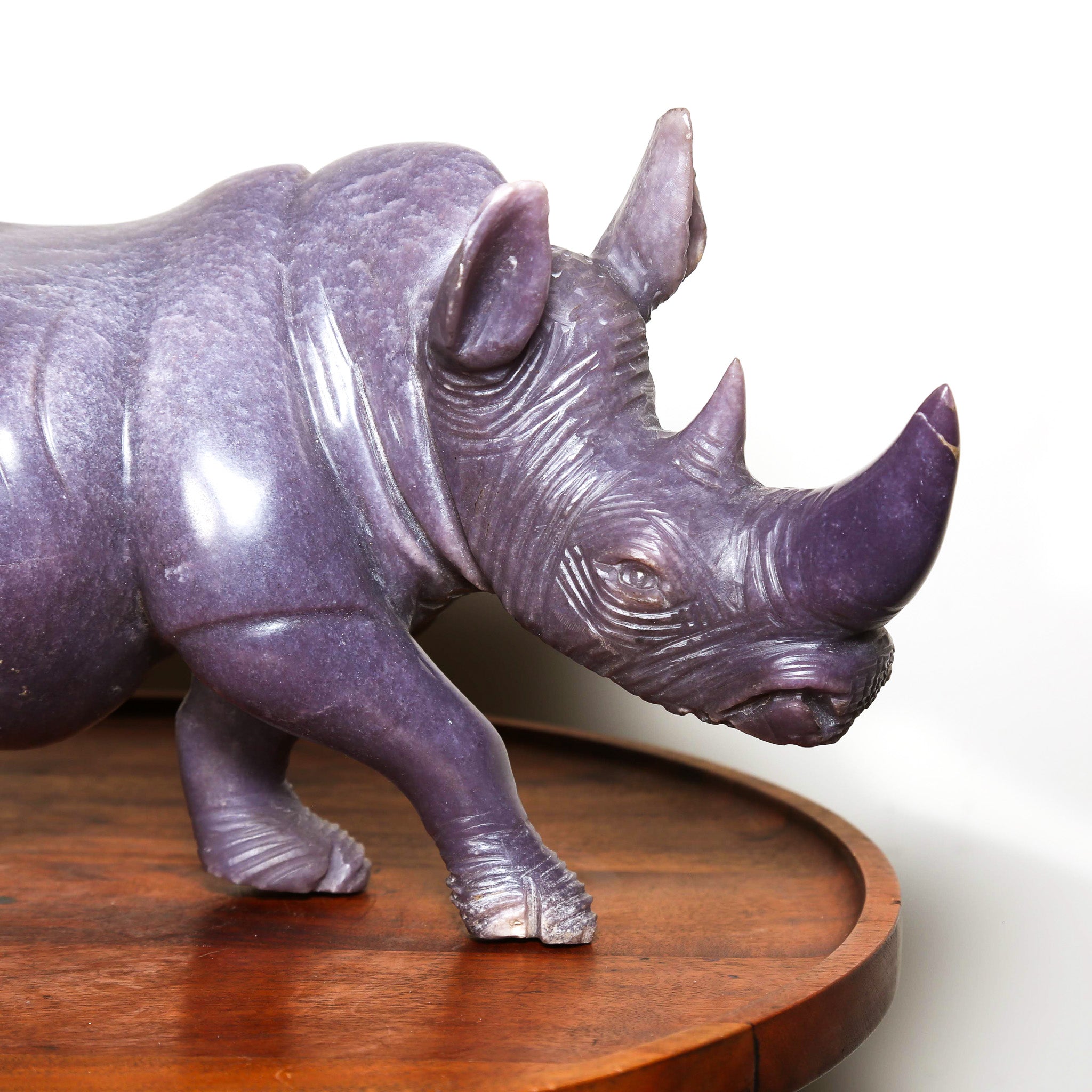 purple sculpture of a rhino