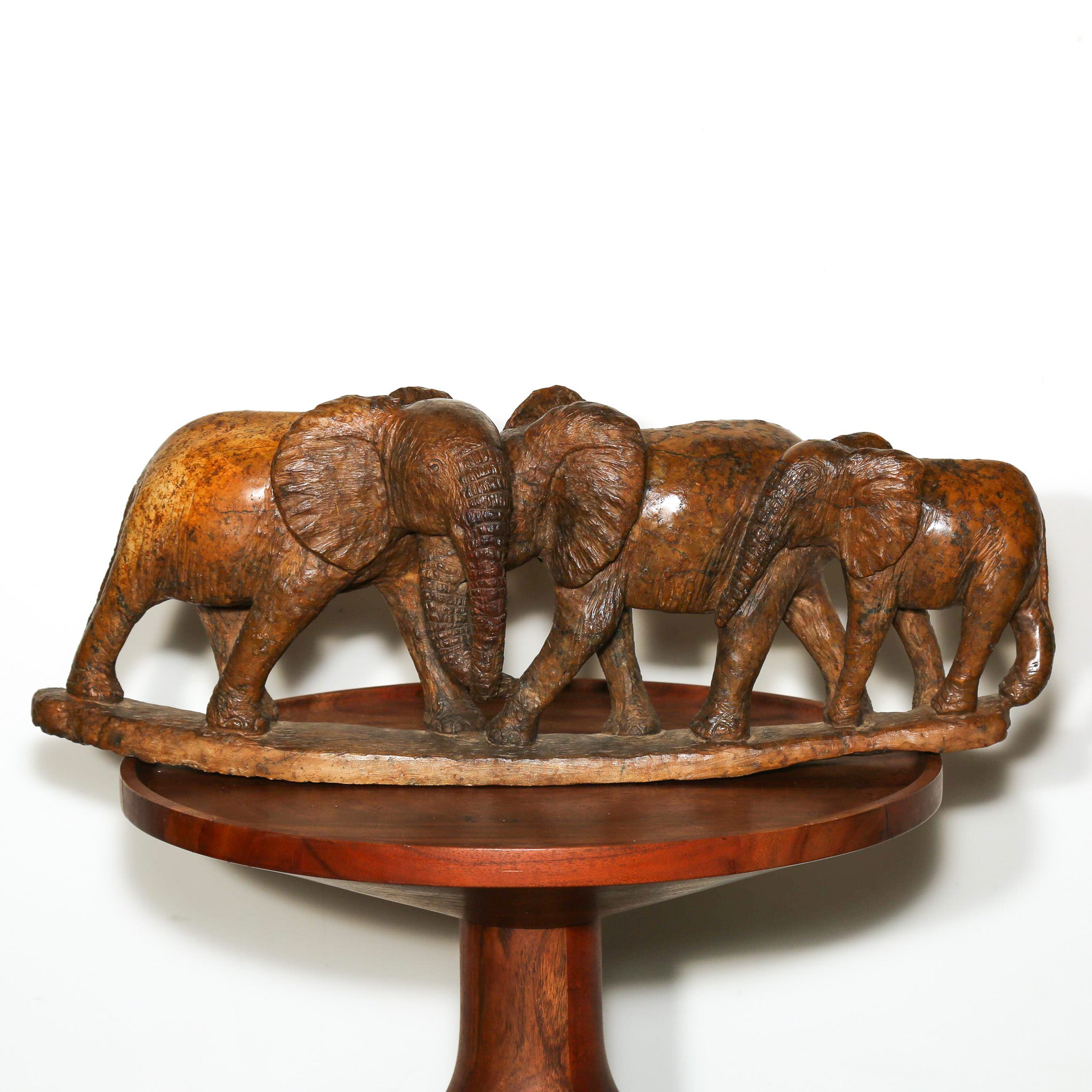 sculpture of three elephants