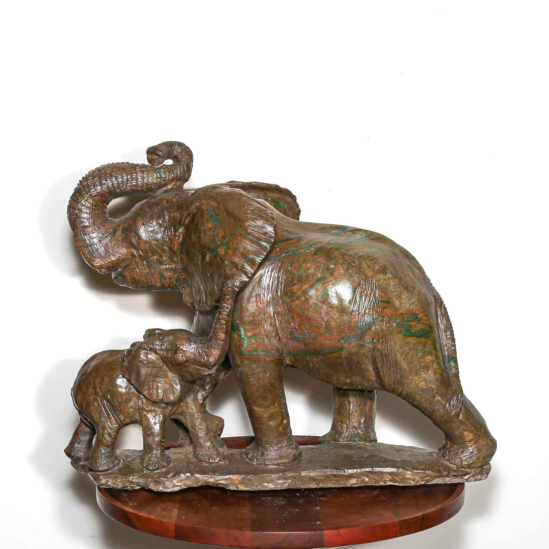 Green stone sculpture of African elephant with baby for sale
