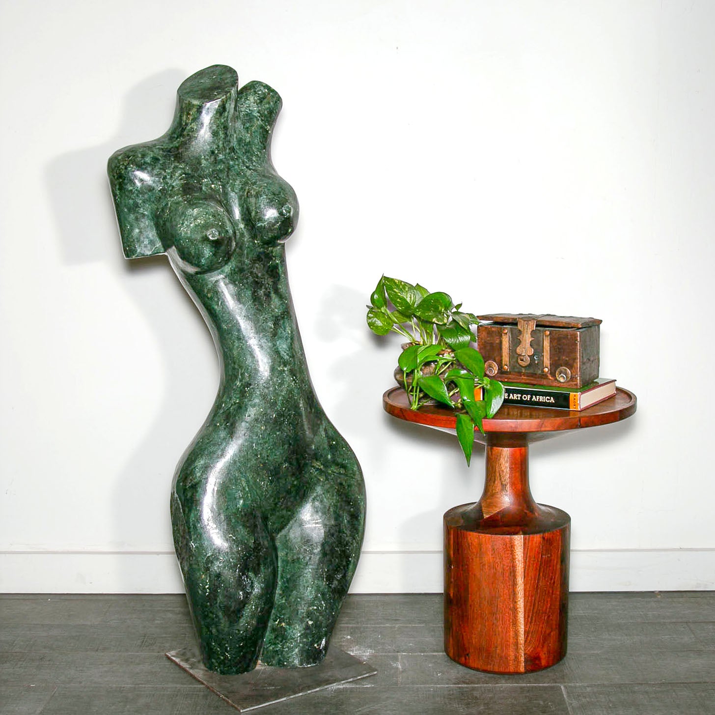 Sculpture of a green abstract woman