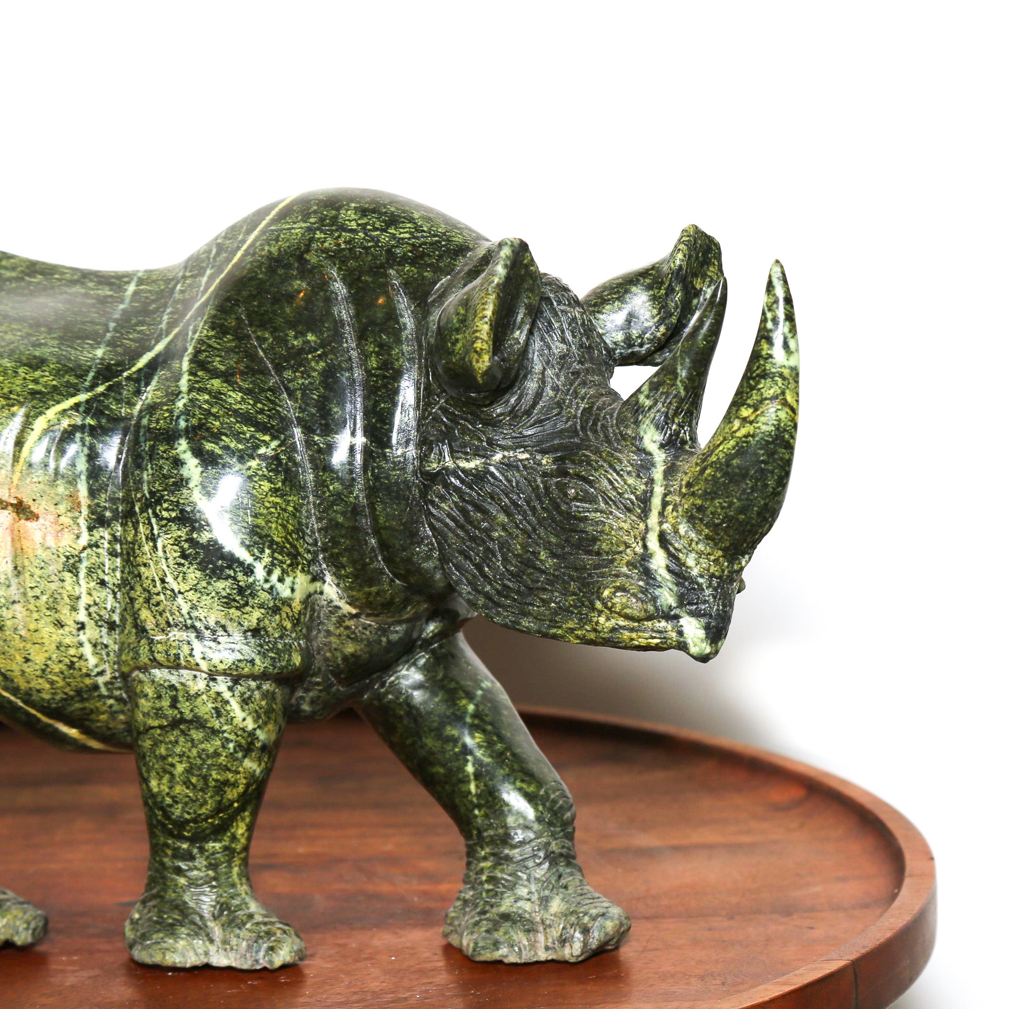 Green stone sculpture of a Rhino from Africa. Carved African collectables for the home