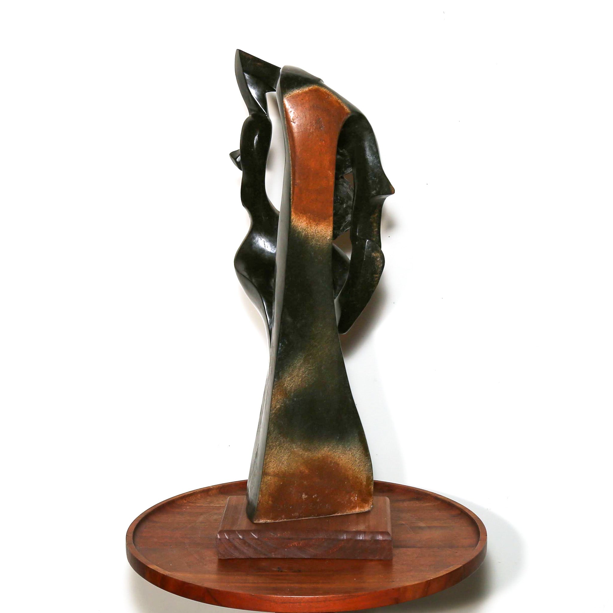 black sculpture with brown details