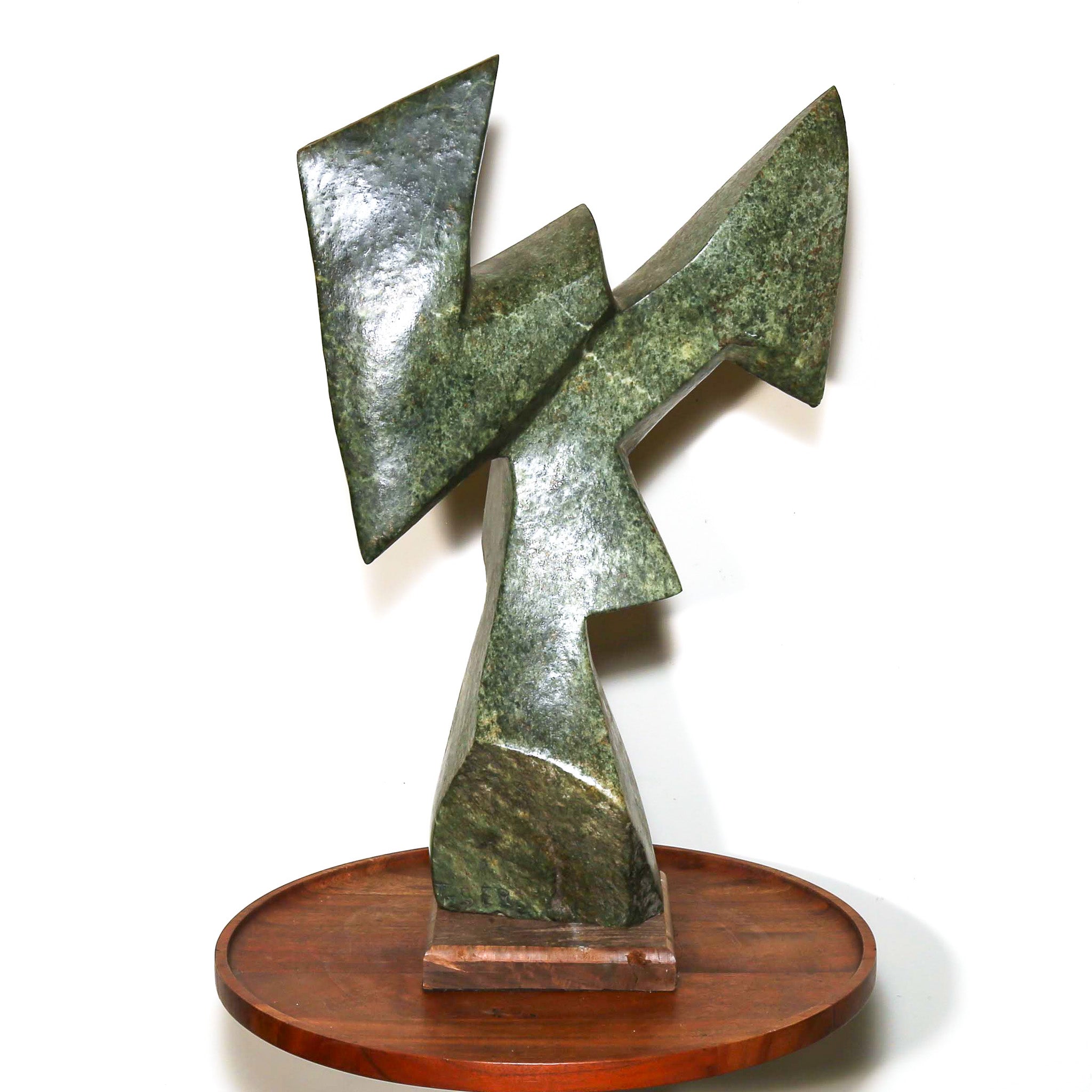 green stone sculpture of modern shapes