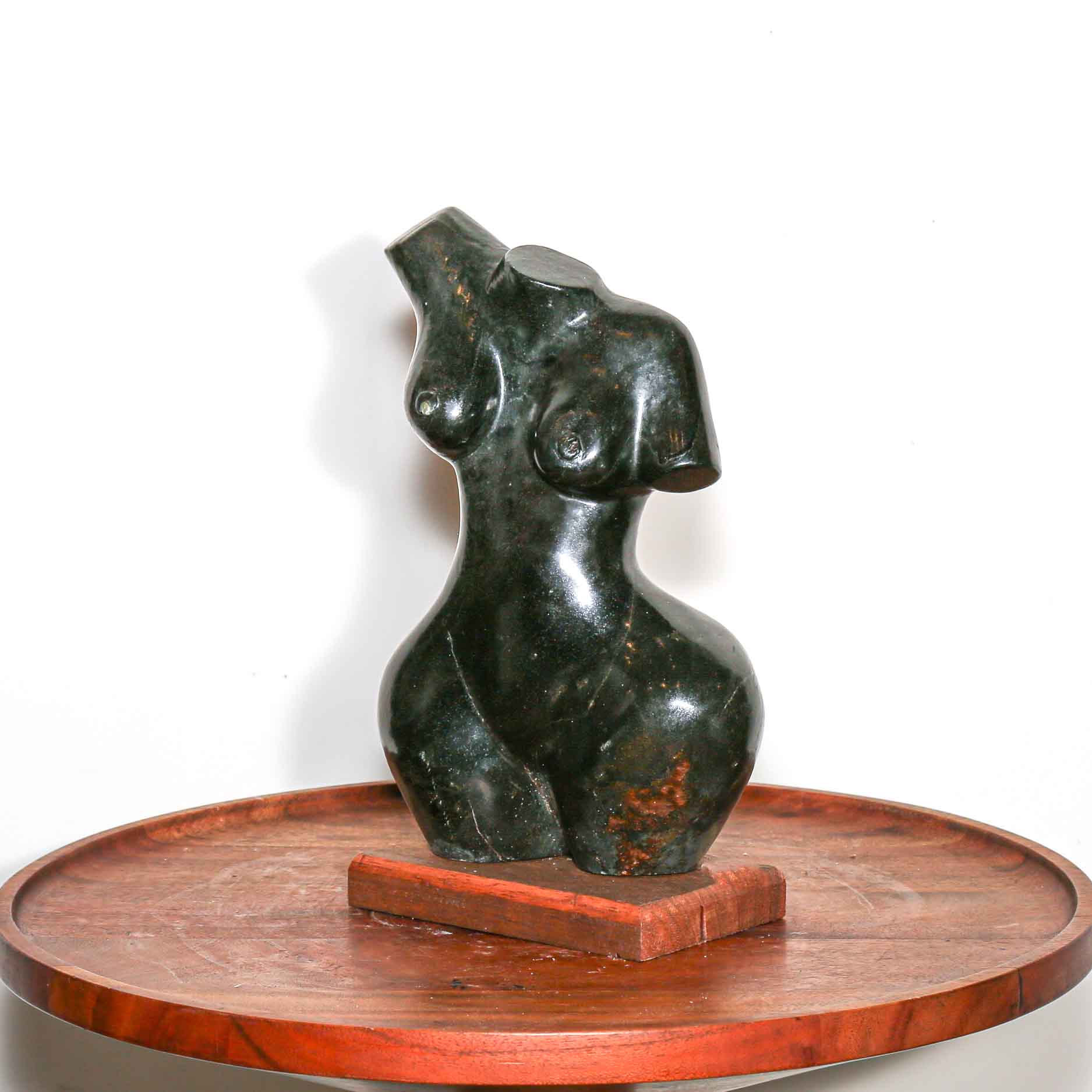 black stone sculpture of an African woman