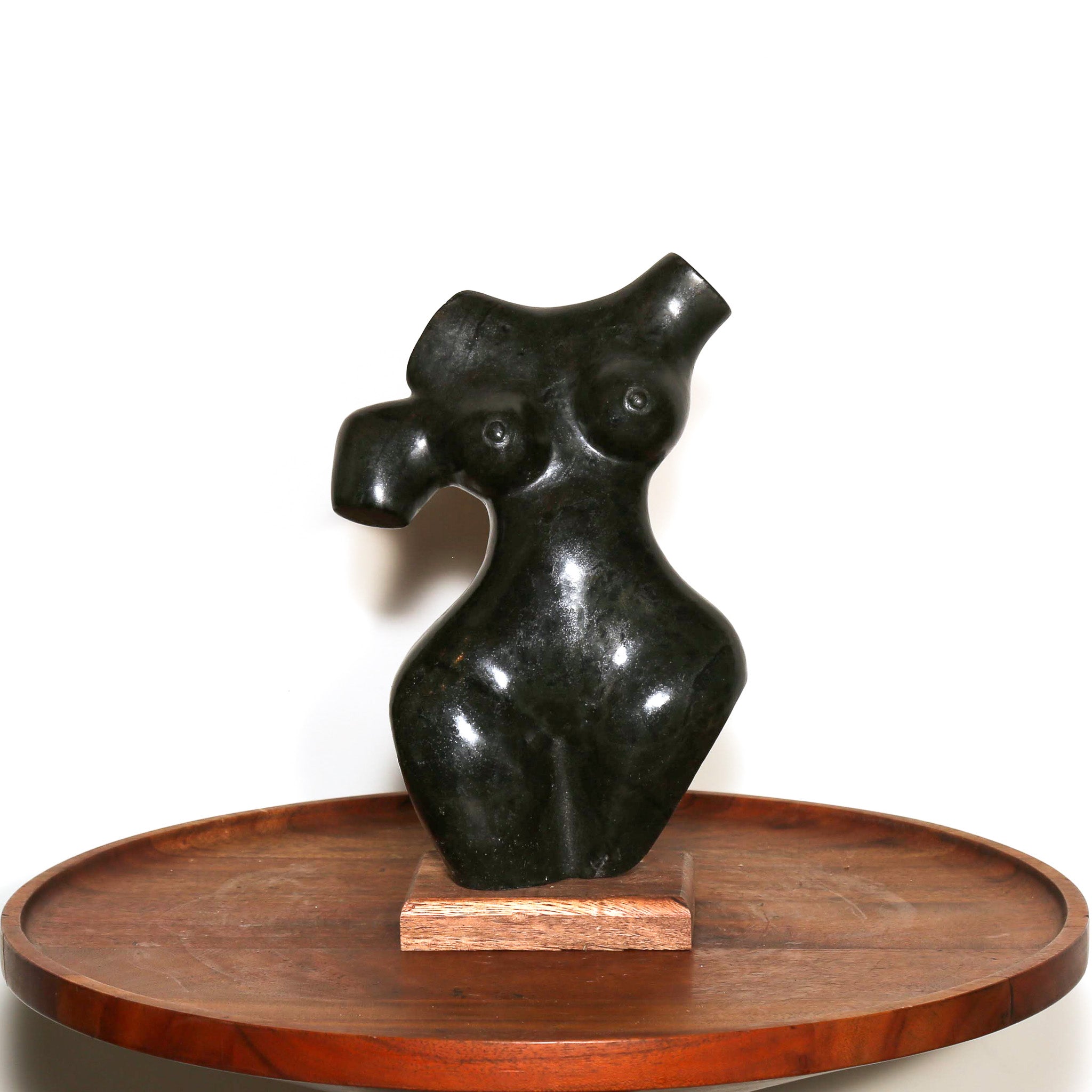 black stone sculpture of a woman