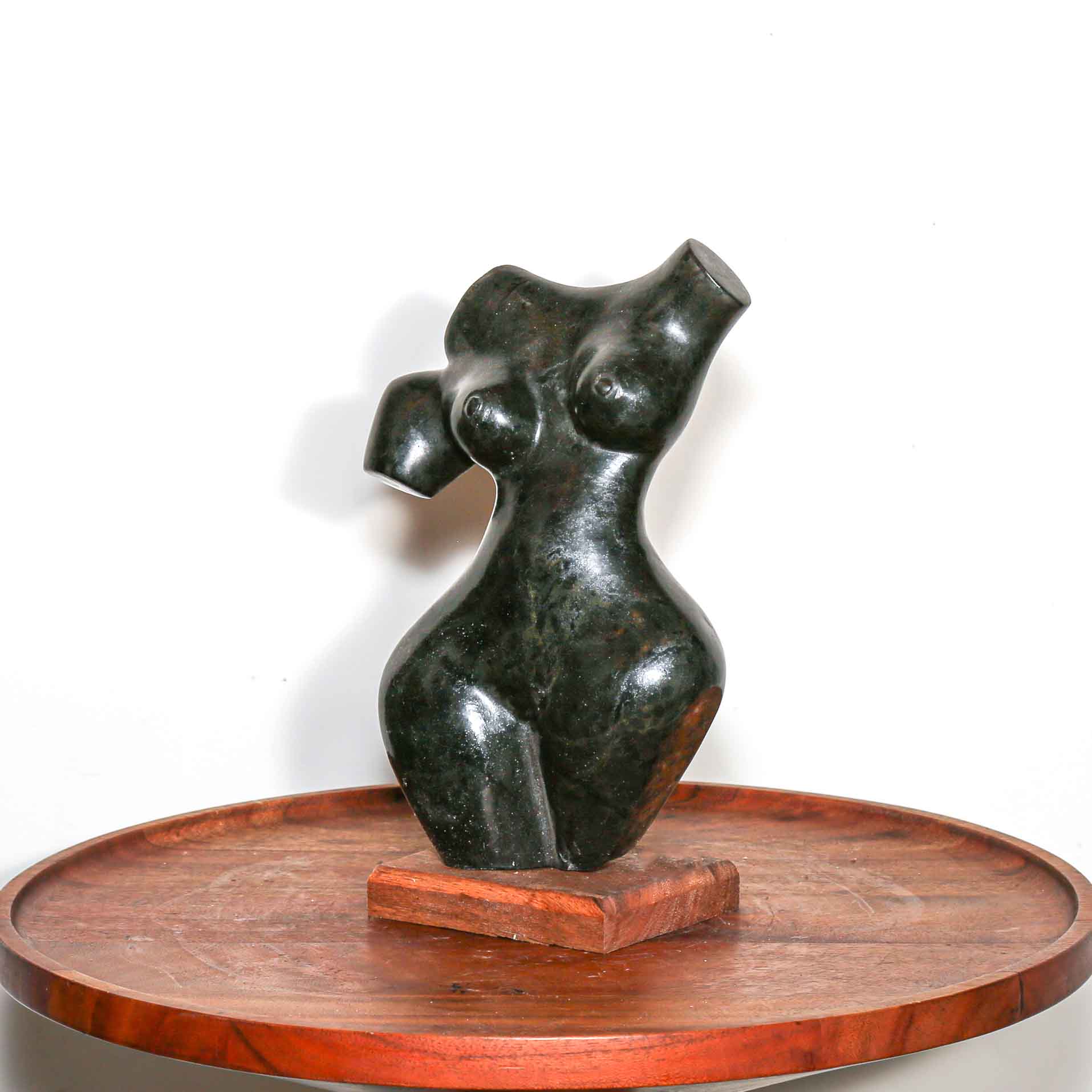 black stone sculpture of a woman