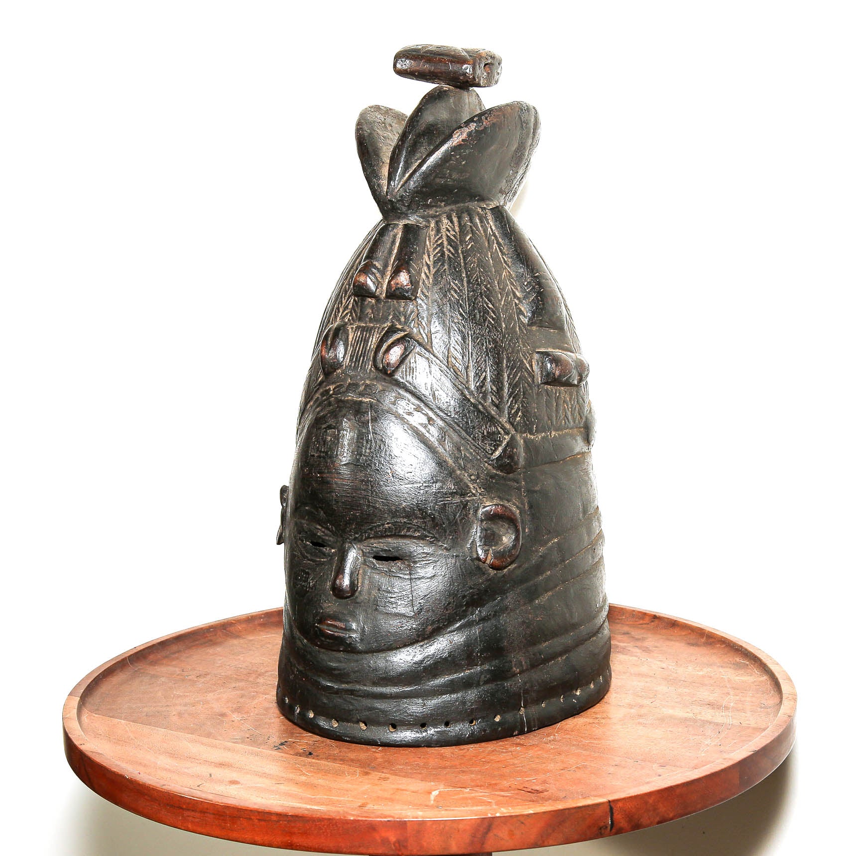 Sierra Leone Mende mask displayed on a side table in a home interior