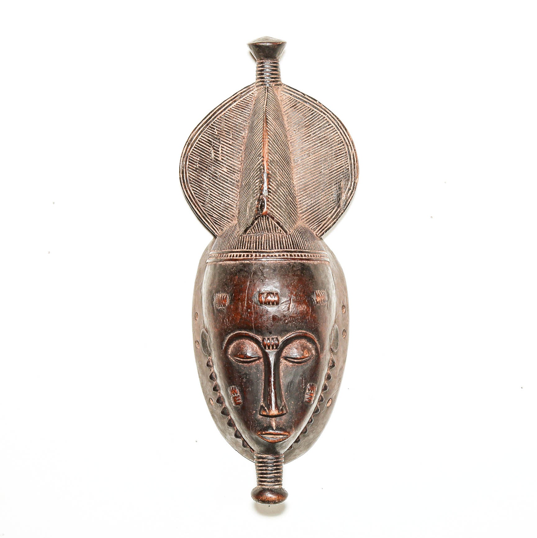 Small brown Baule Kpan mask from Ivory Coast