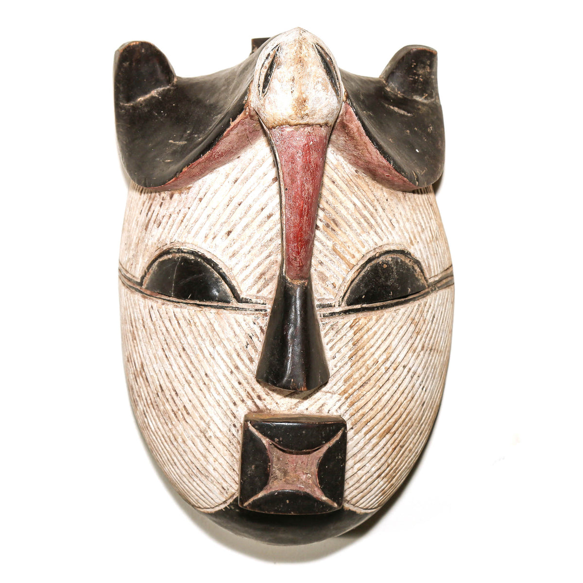 Congolese Songye mask with black and white painted details, carved wood construction, and distinctive tribal art styling