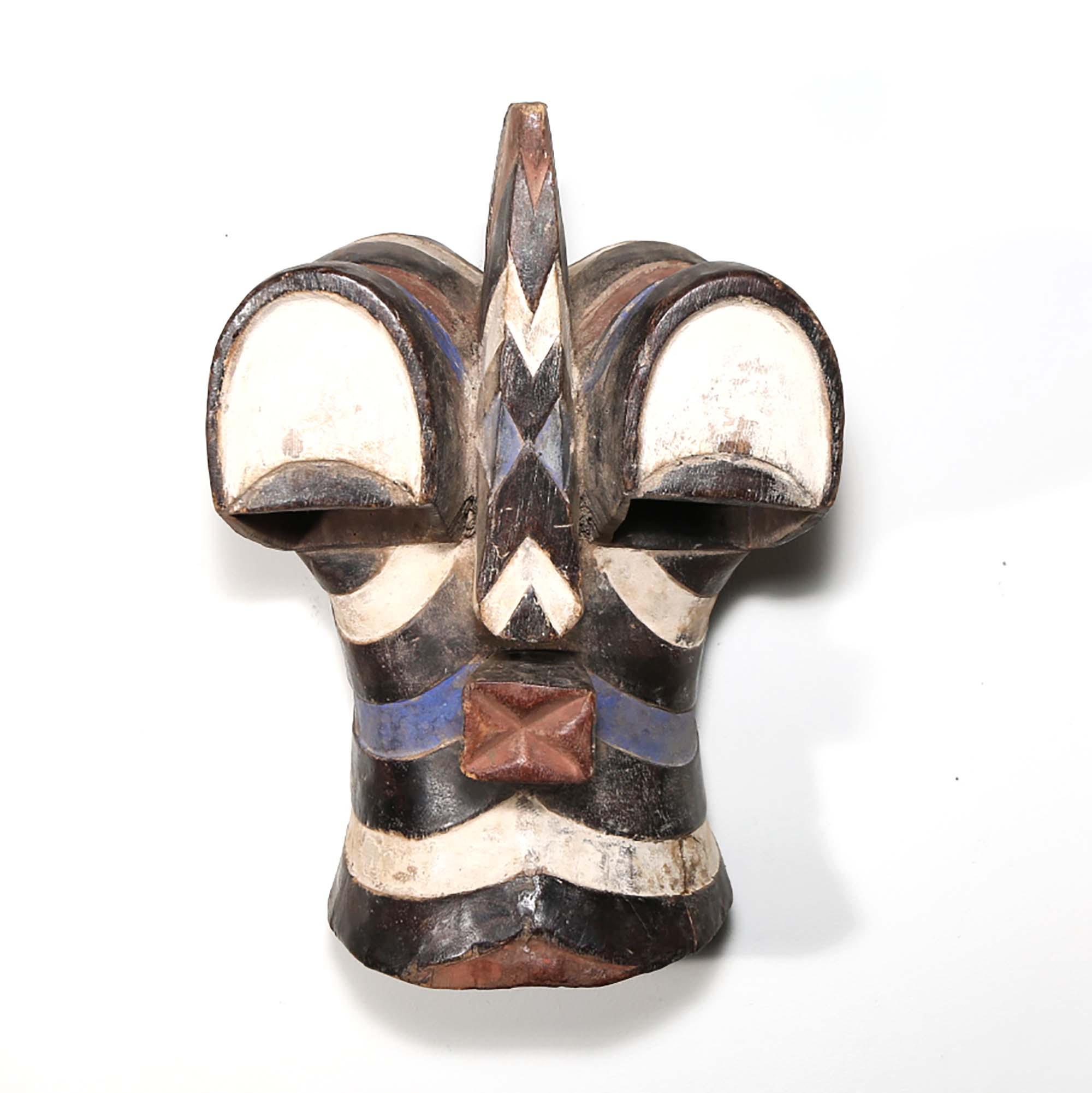 Songye Mask from D.R. Congo displayed as an African mask wall decor idea