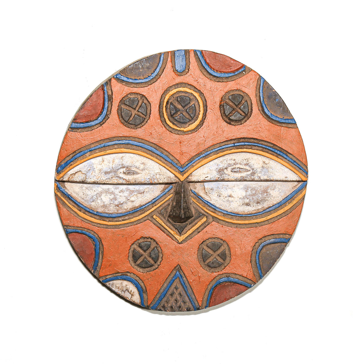 Colorful round Teke mask with bold painted geometric patterns and a distinctive circular carved wood form