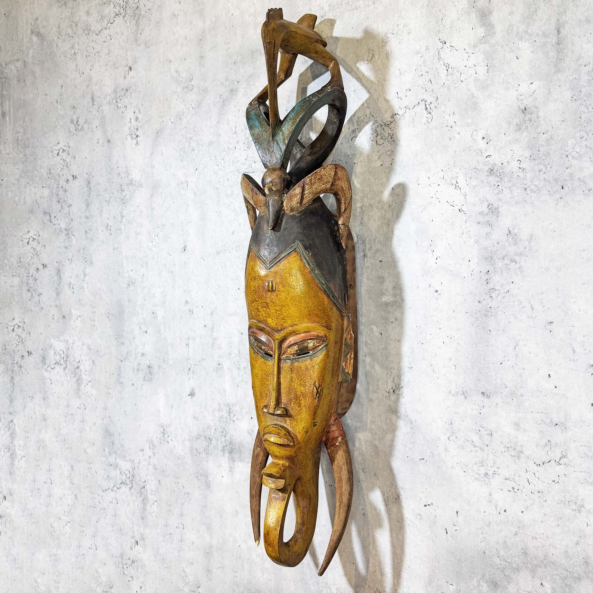 Right side of Guro Mask from Côte d'Ivoire Yellow-Green as a wall decoration idea