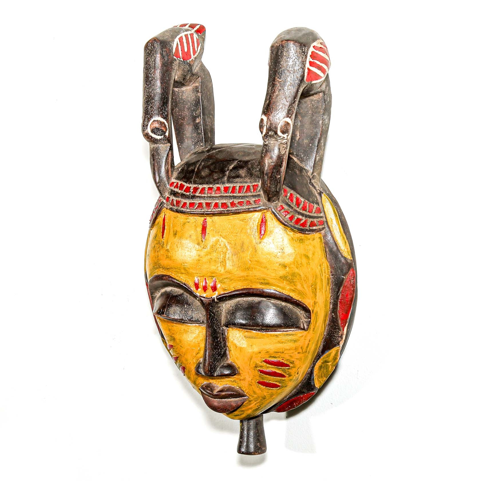 yellow wooden African mask with birds to collect and hang on your wall for fine interior design ideas. 