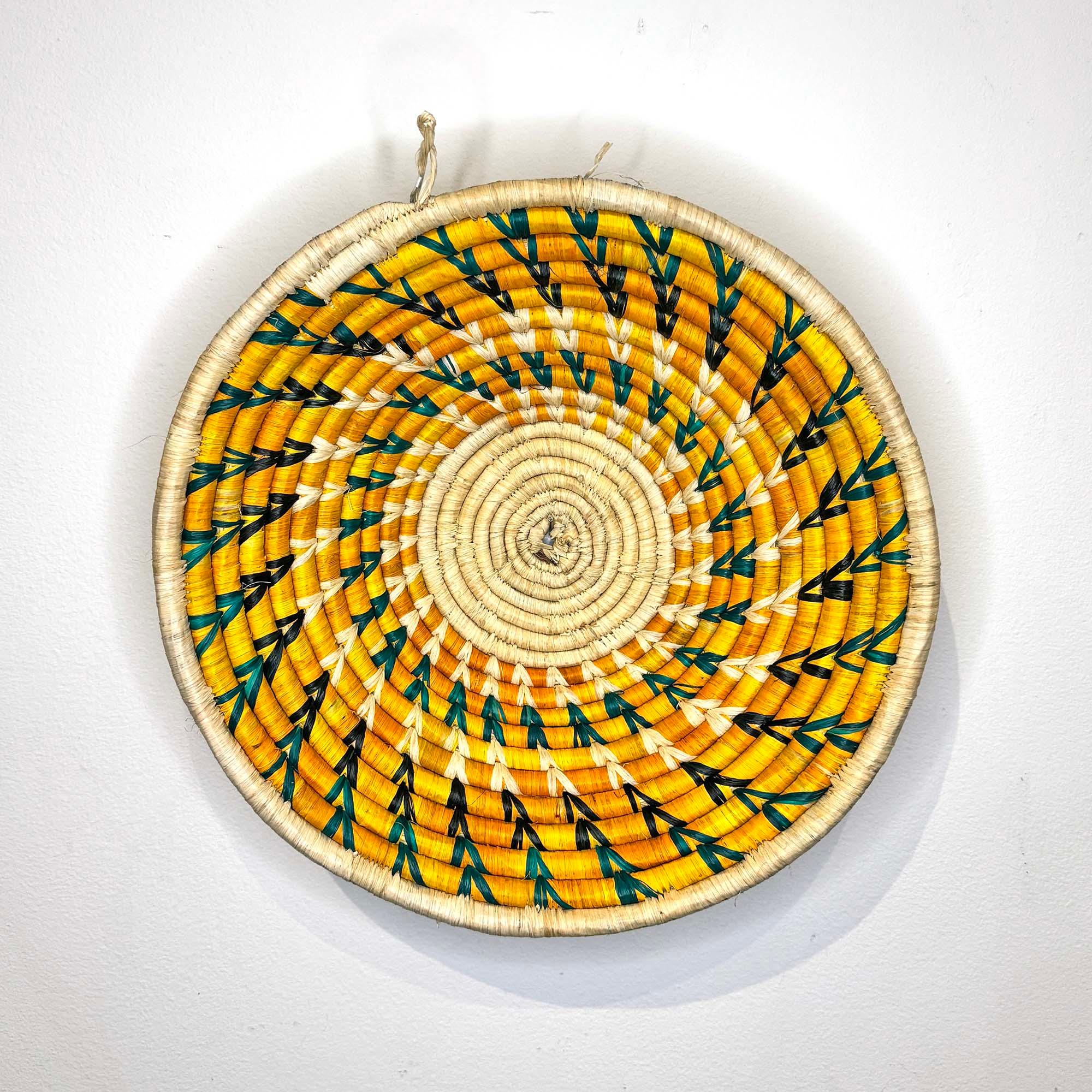 Yellow Woven Basket Handmade in Uganda as a wall decor idea