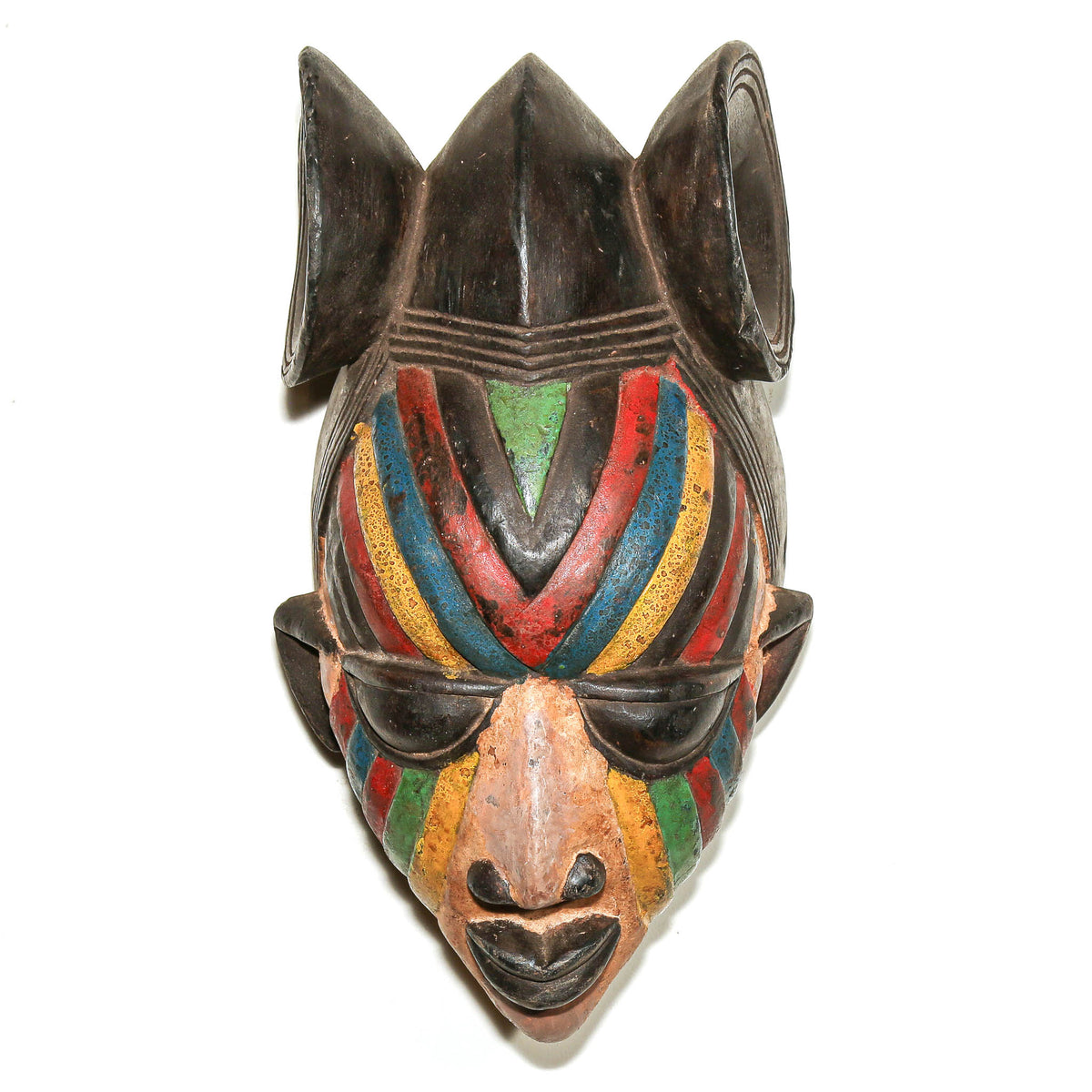 Colorful Yoruba Egungun mask from Nigeria with bold painted details and a traditional carved wood form