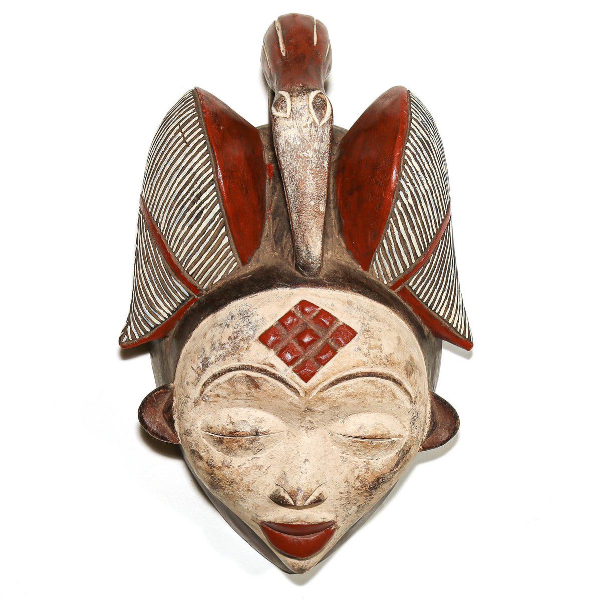 Large Punu mask from Gabon with elegant carved facial features and traditional Central African design