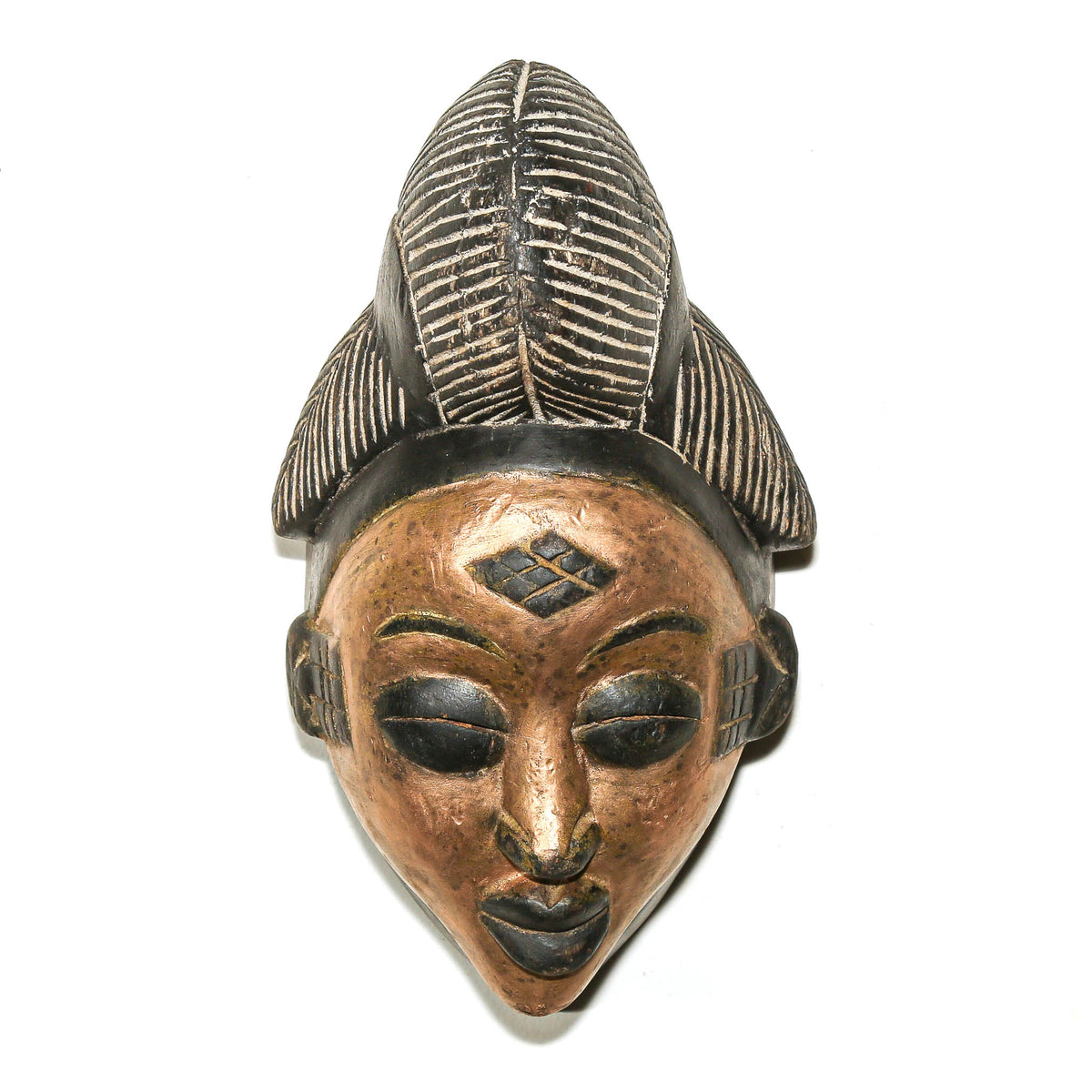 Punu mask from Gabon with a gold painted face, refined carved facial features, and an elegant Central African sculptural form