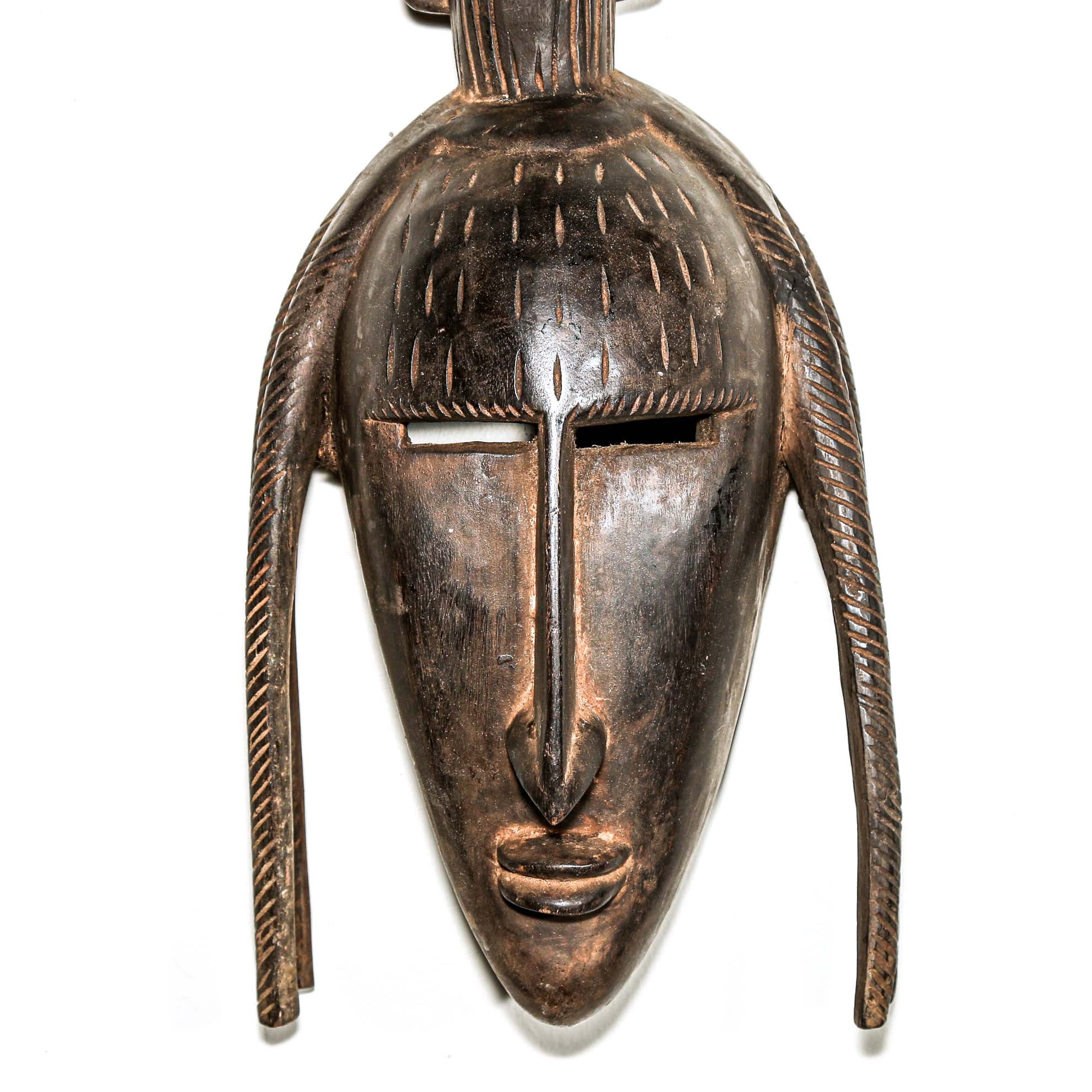 finely carved wooden modern african wall mask. Home and living room decor to hang on the wall