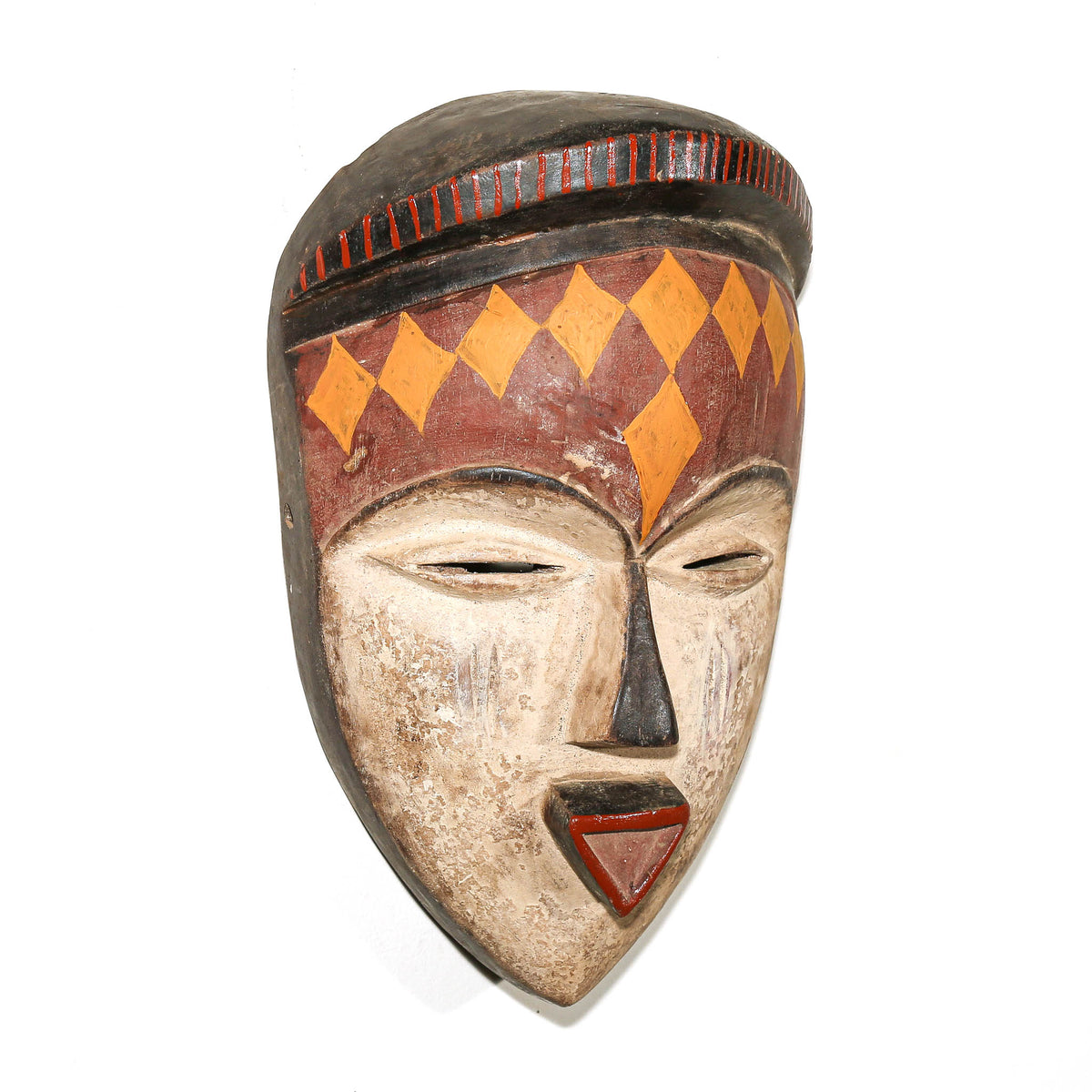 Hand-carved Pende African mask from Congo featuring classic geometric details and expressive facial design