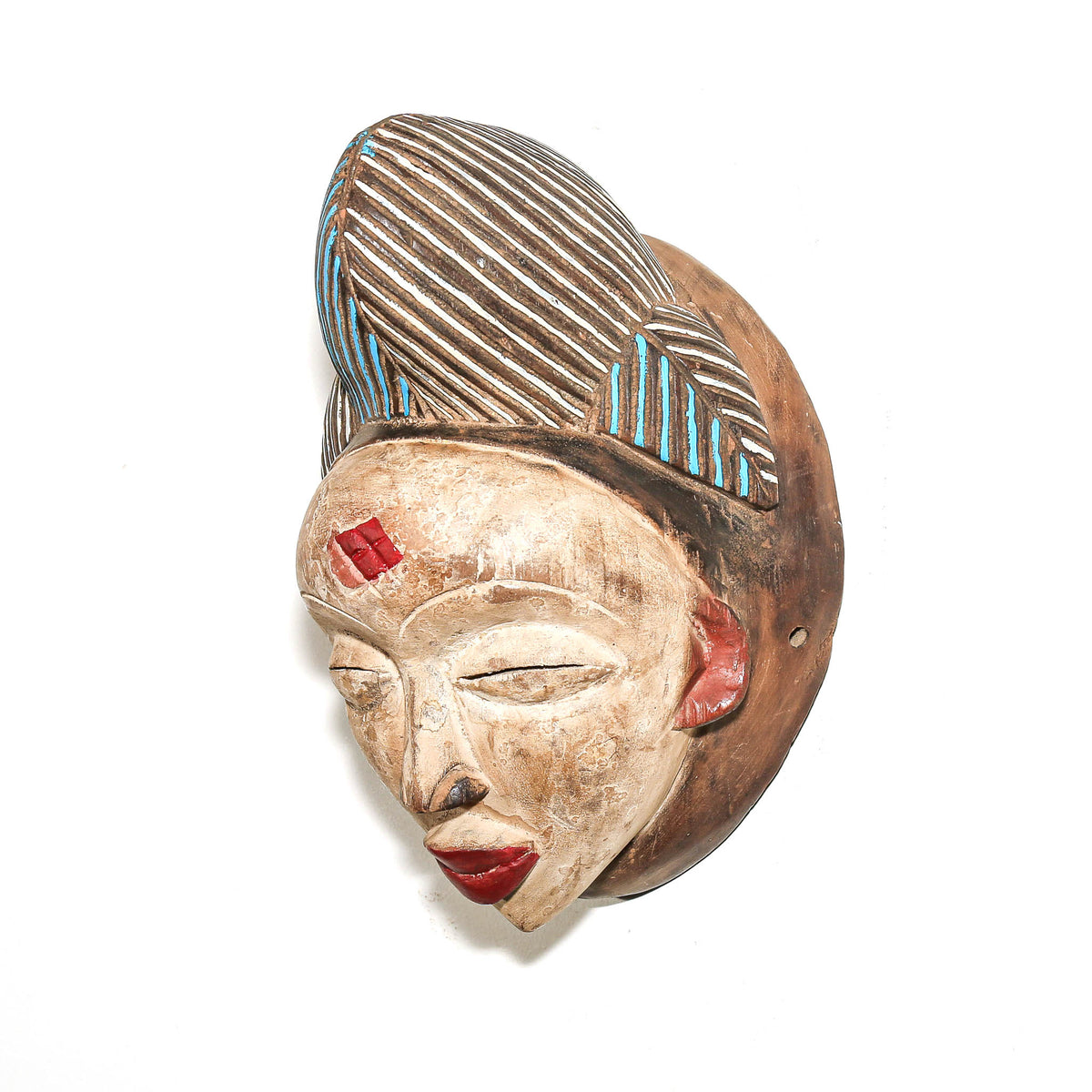 Traditional Punu African mask featuring blue and red accents with elegant sculptural details from Gabon