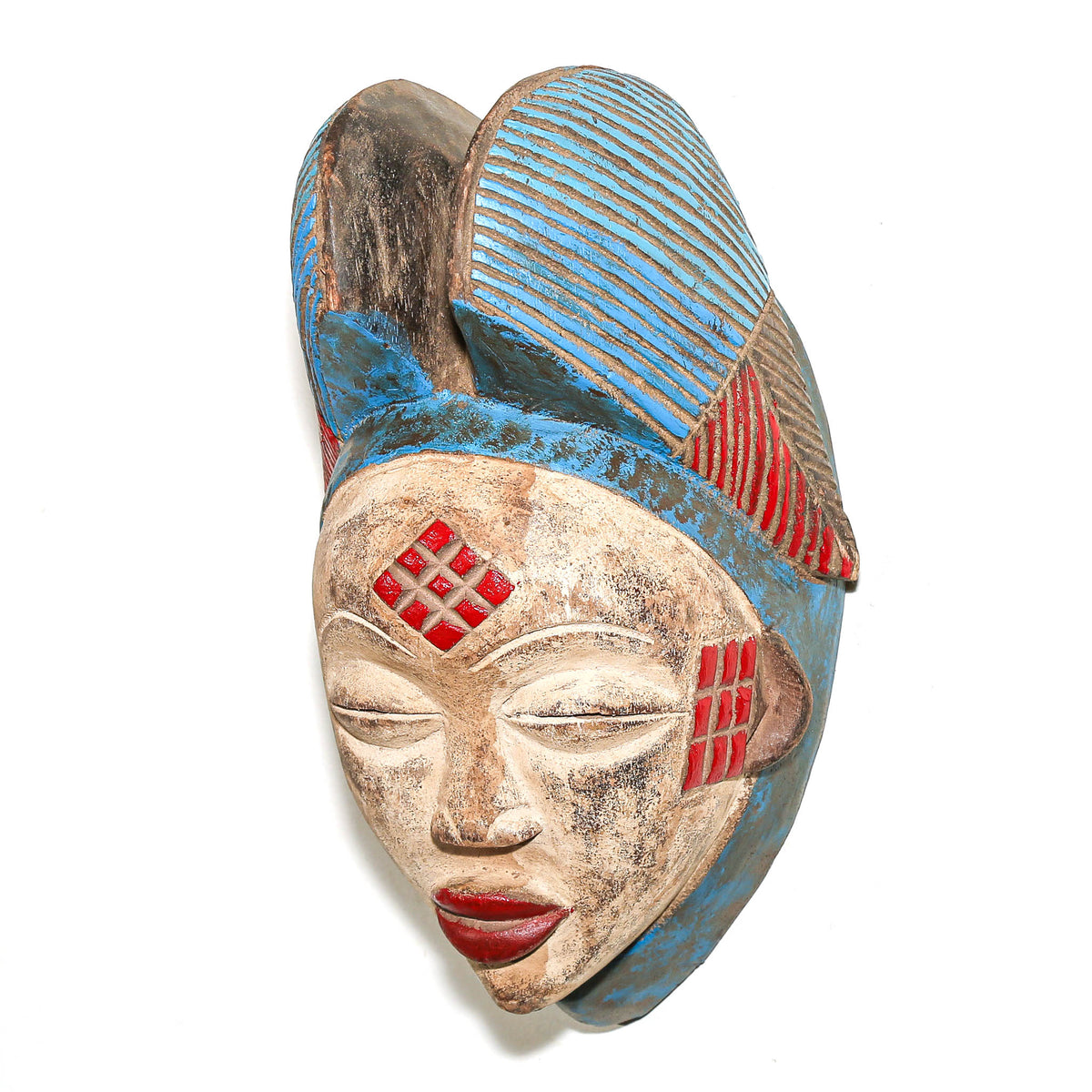 Hand-carved Gabonese Punu face mask featuring red and blue accents, smooth contours, and traditional Central African styling