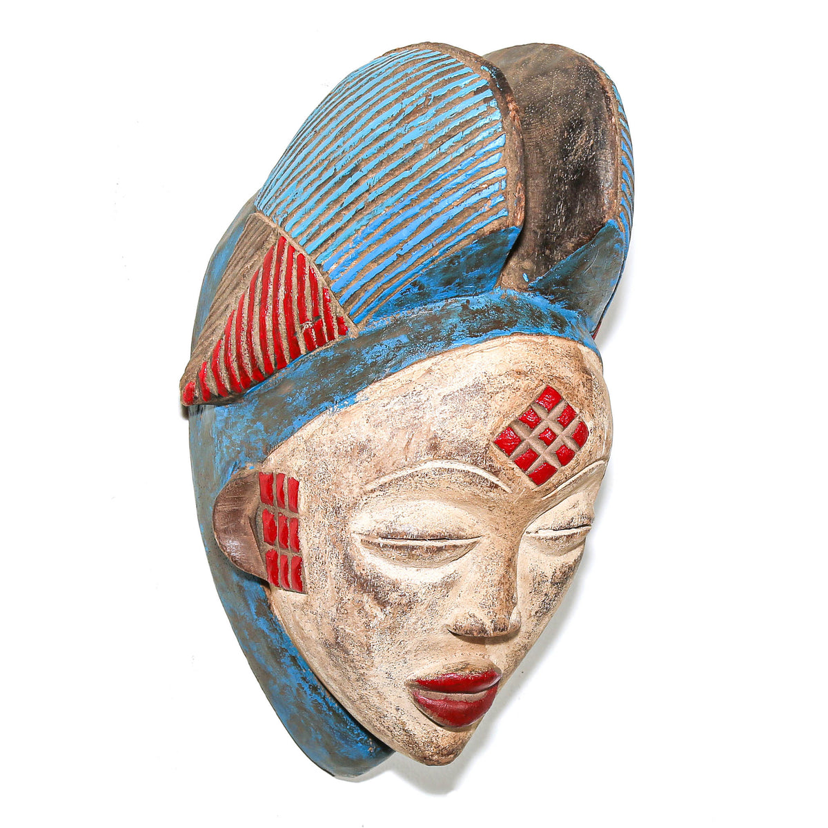 Traditional Punu mask with red and blue decorative details, balanced facial proportions, and sculptural presence in African art