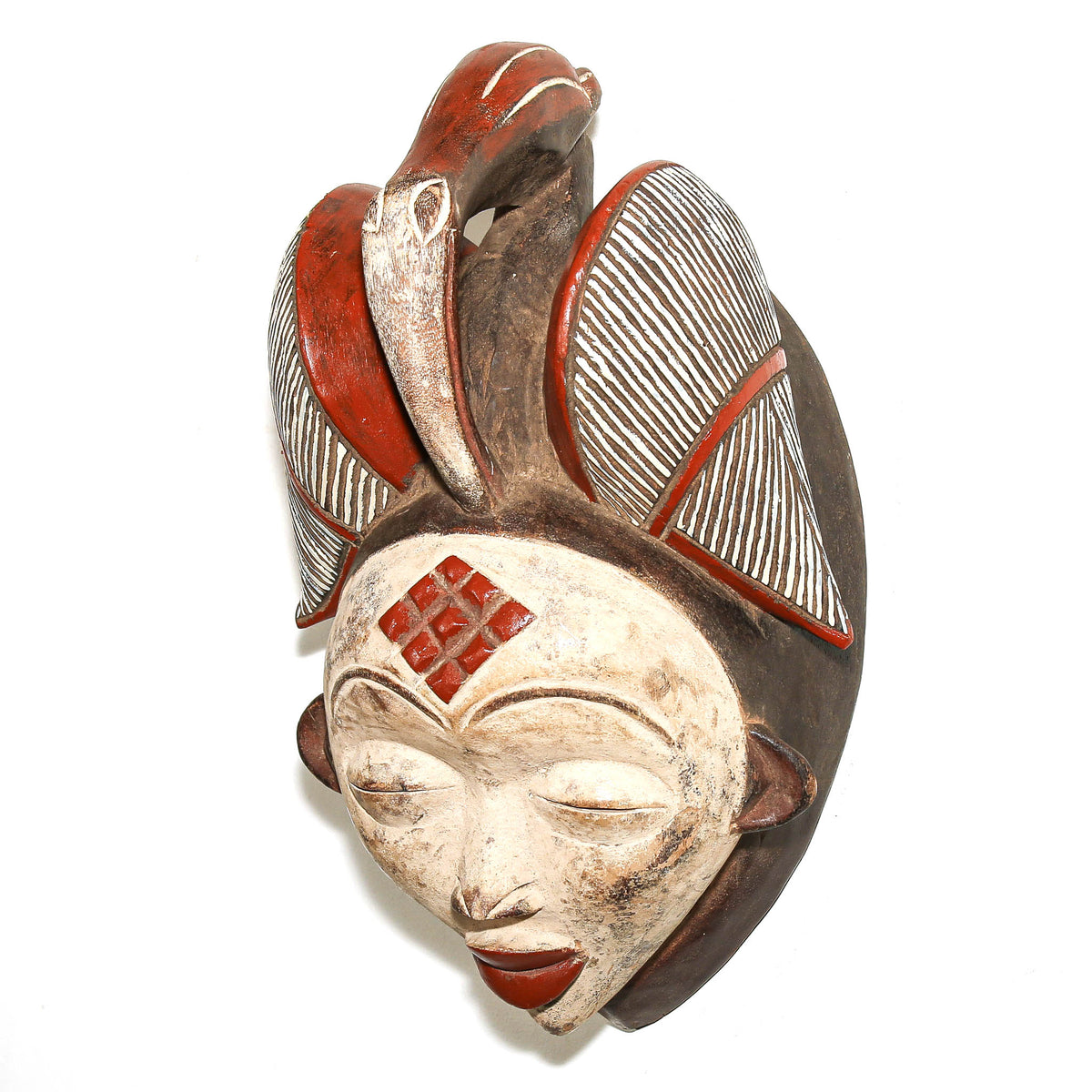 Large Gabonese Punu face mask displayed as collectible African tribal art with strong decorative presence
