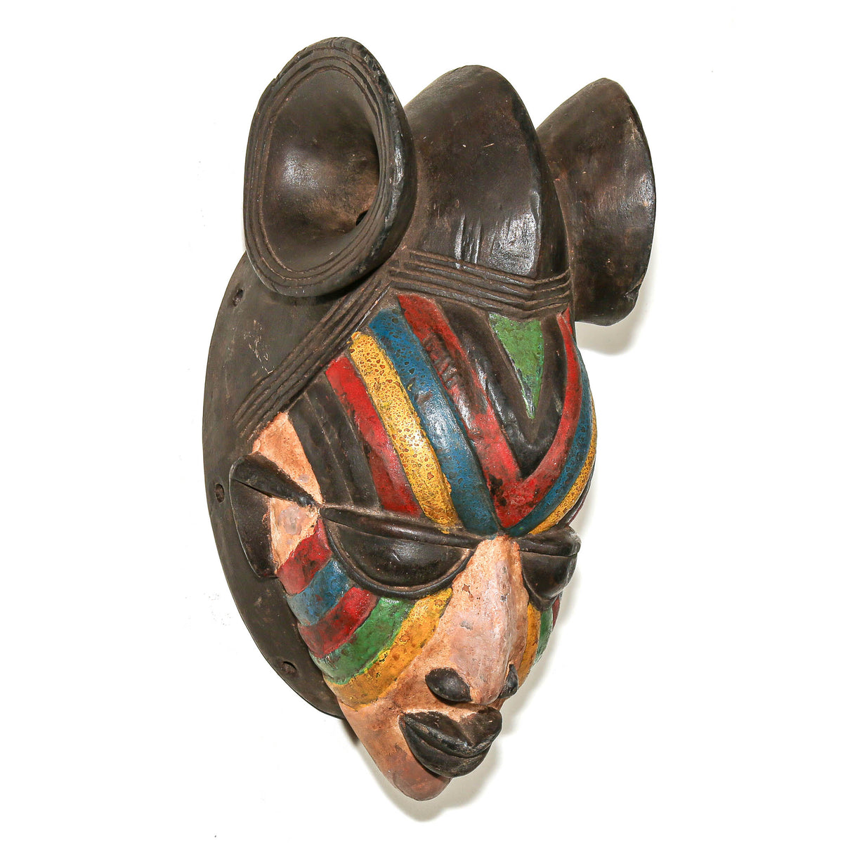 Hand-carved Yoruba Egungun-style mask from Nigeria with colorful painted decoration and expressive facial details