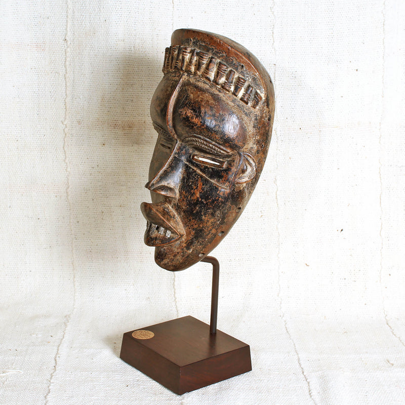 Realistic mask hand carved from one piece of wood