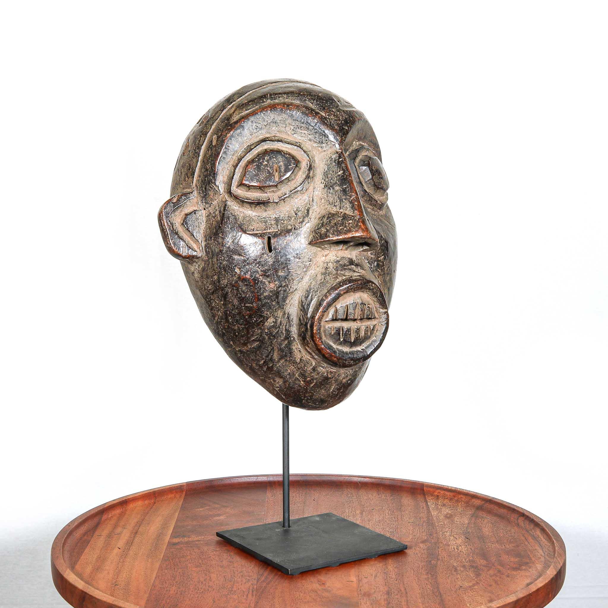 Night Society Bamaleki Mask, Cameroon left on a stand