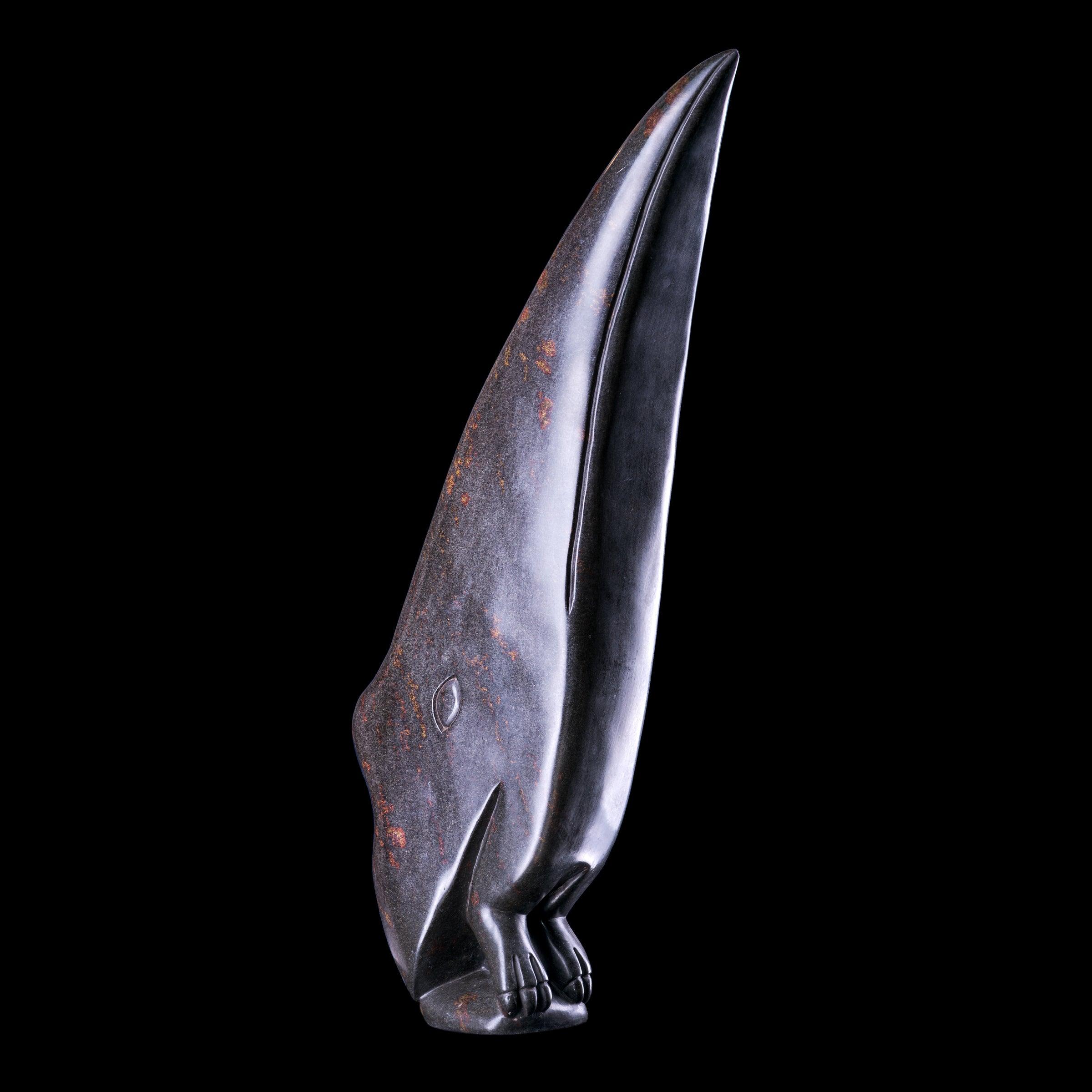 black sculpture art from Africa on a black background