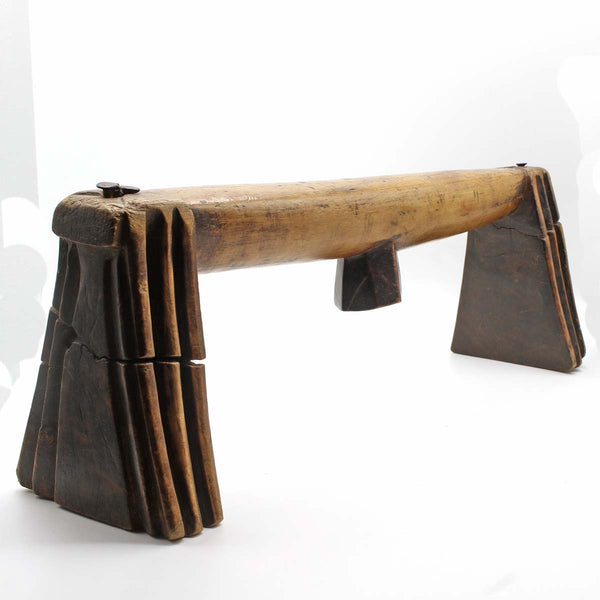 long old wooden headrest with high patina