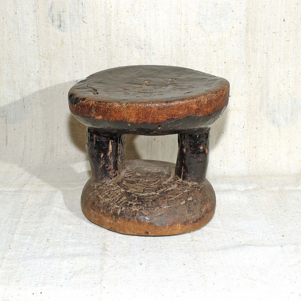 Reverse of Tonga stool with black patina