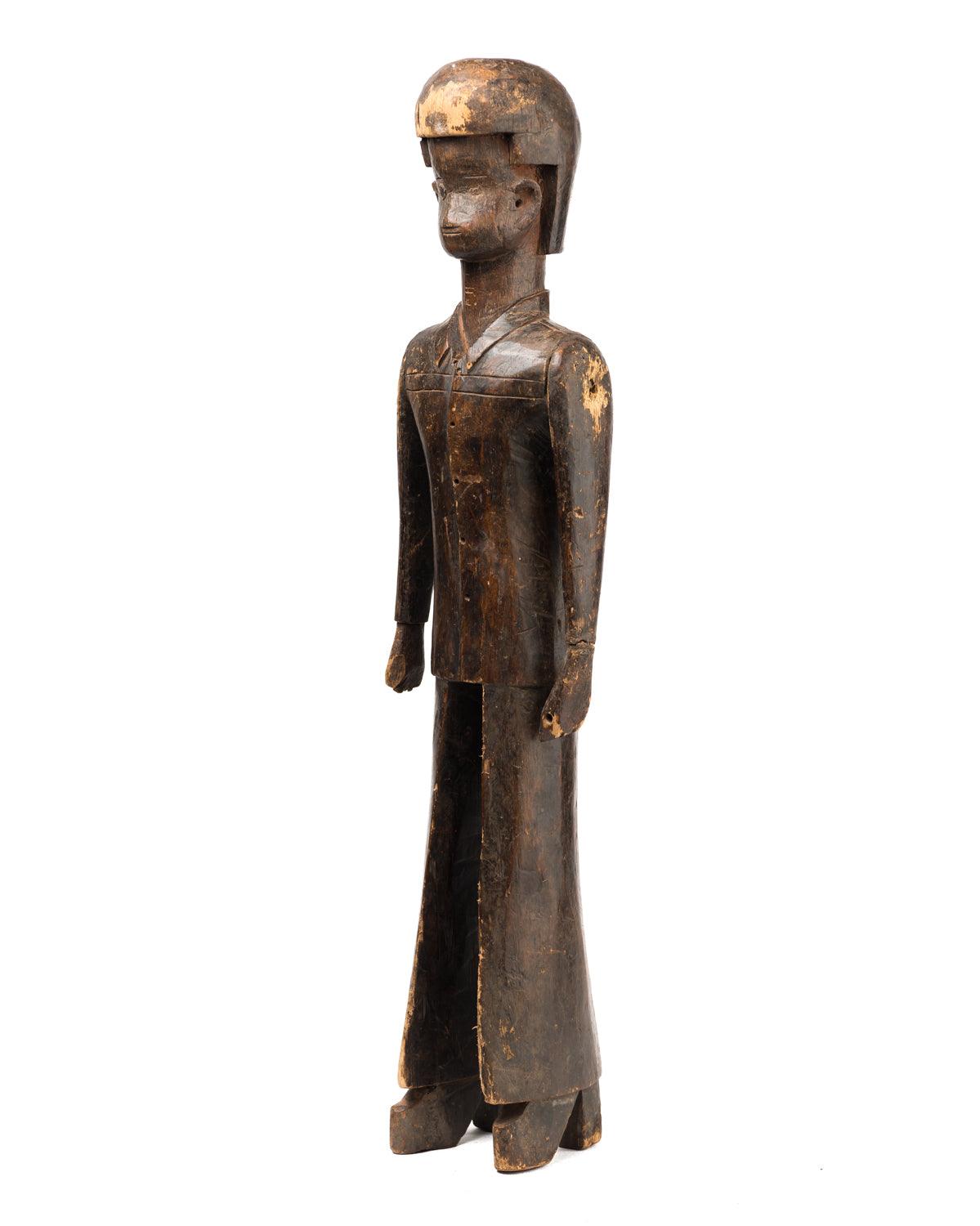 Antique wood African sculpture that looks like Elvis