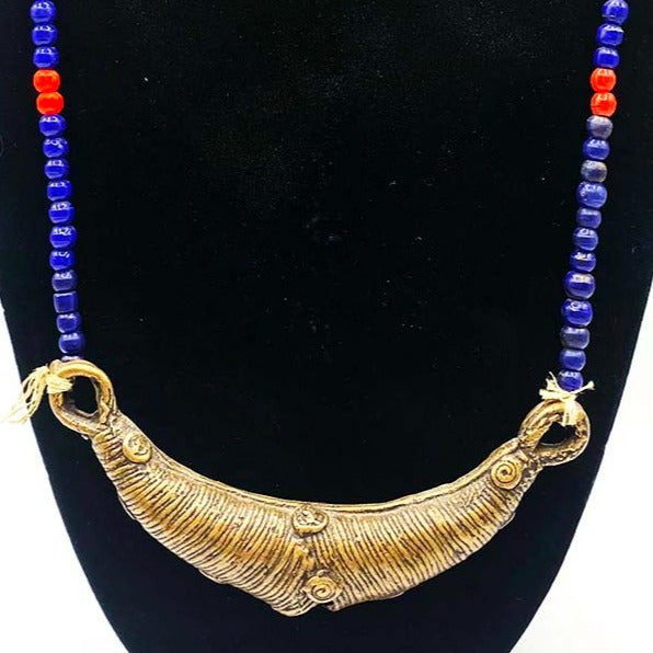 Metal antique jewelry from Africa with blue beaded chain
