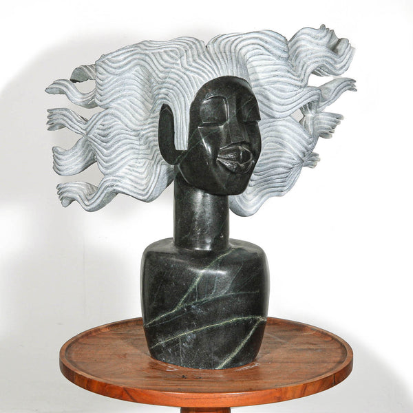 Stylized statue of a woman