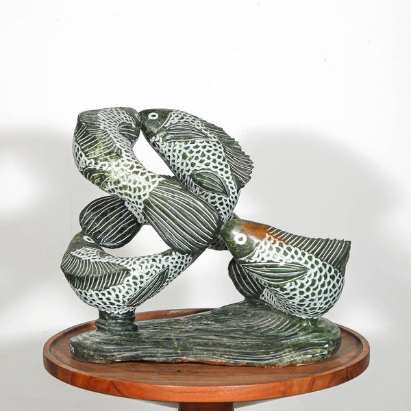 Swimming fish sculpture for outdoor design