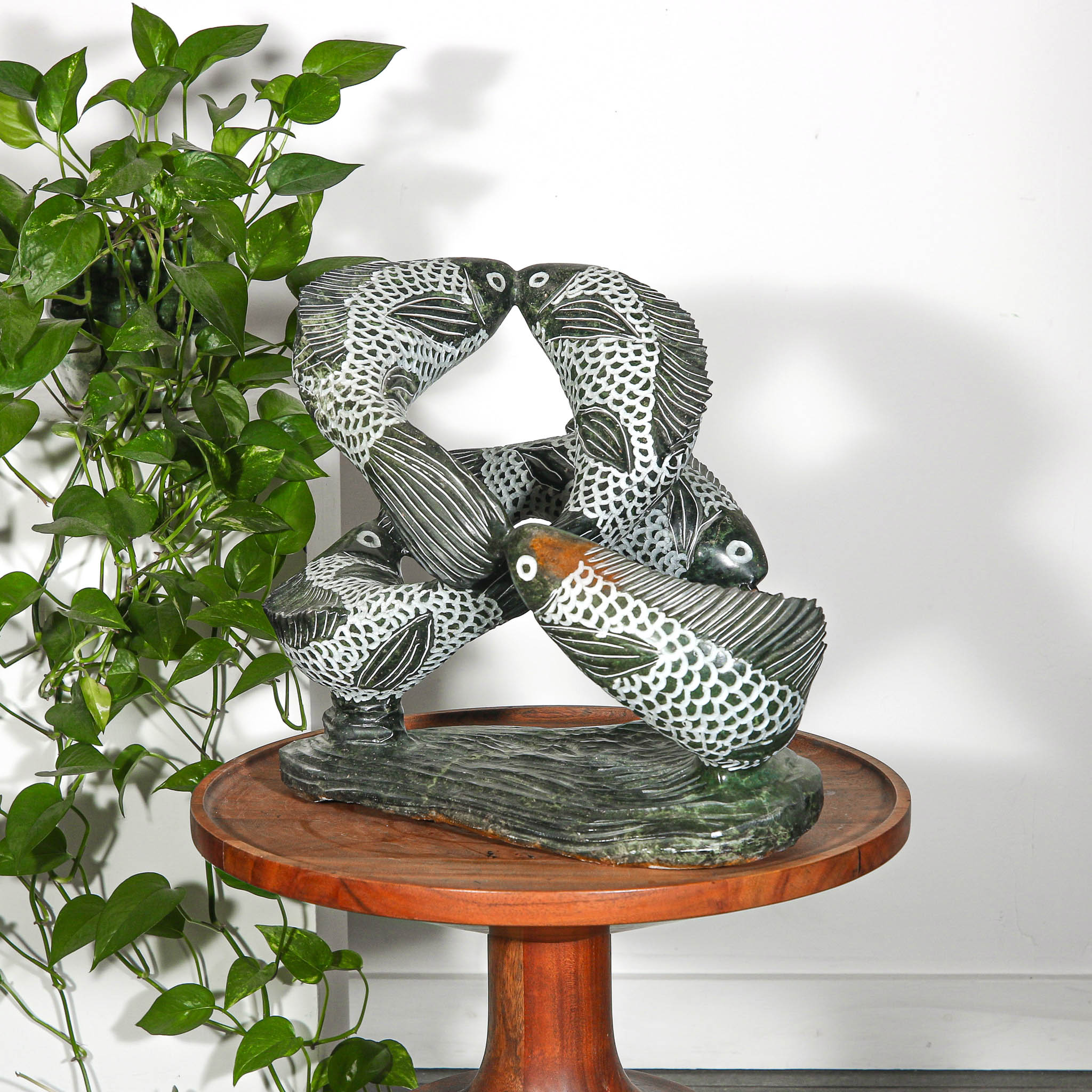 Swimming fish sculpture for outdoor design