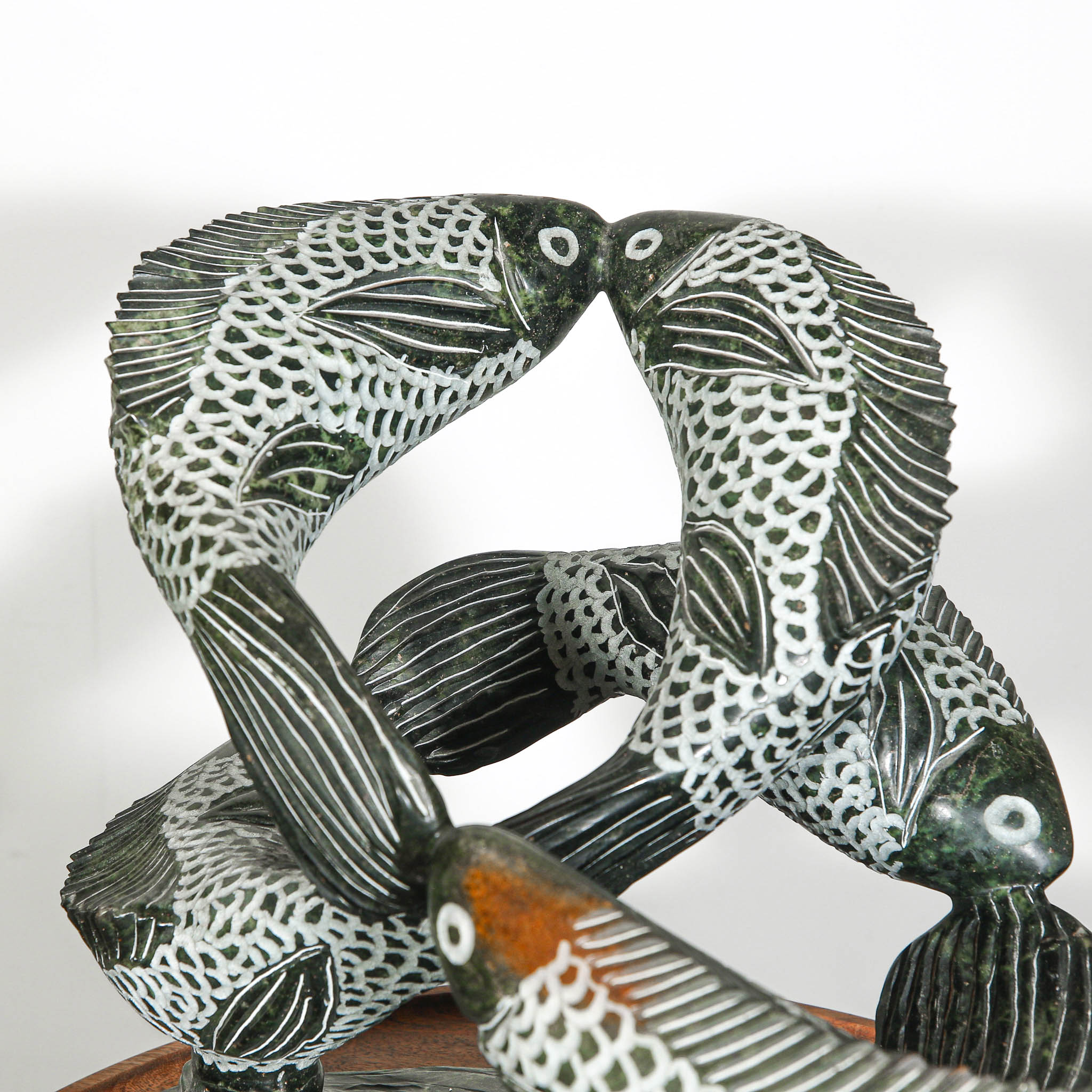 Swimming fish sculpture for outdoor design