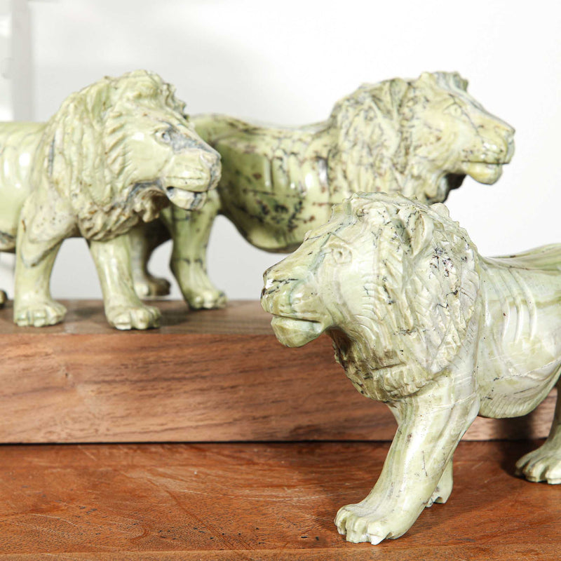 Small hand carvings of lions from Africa