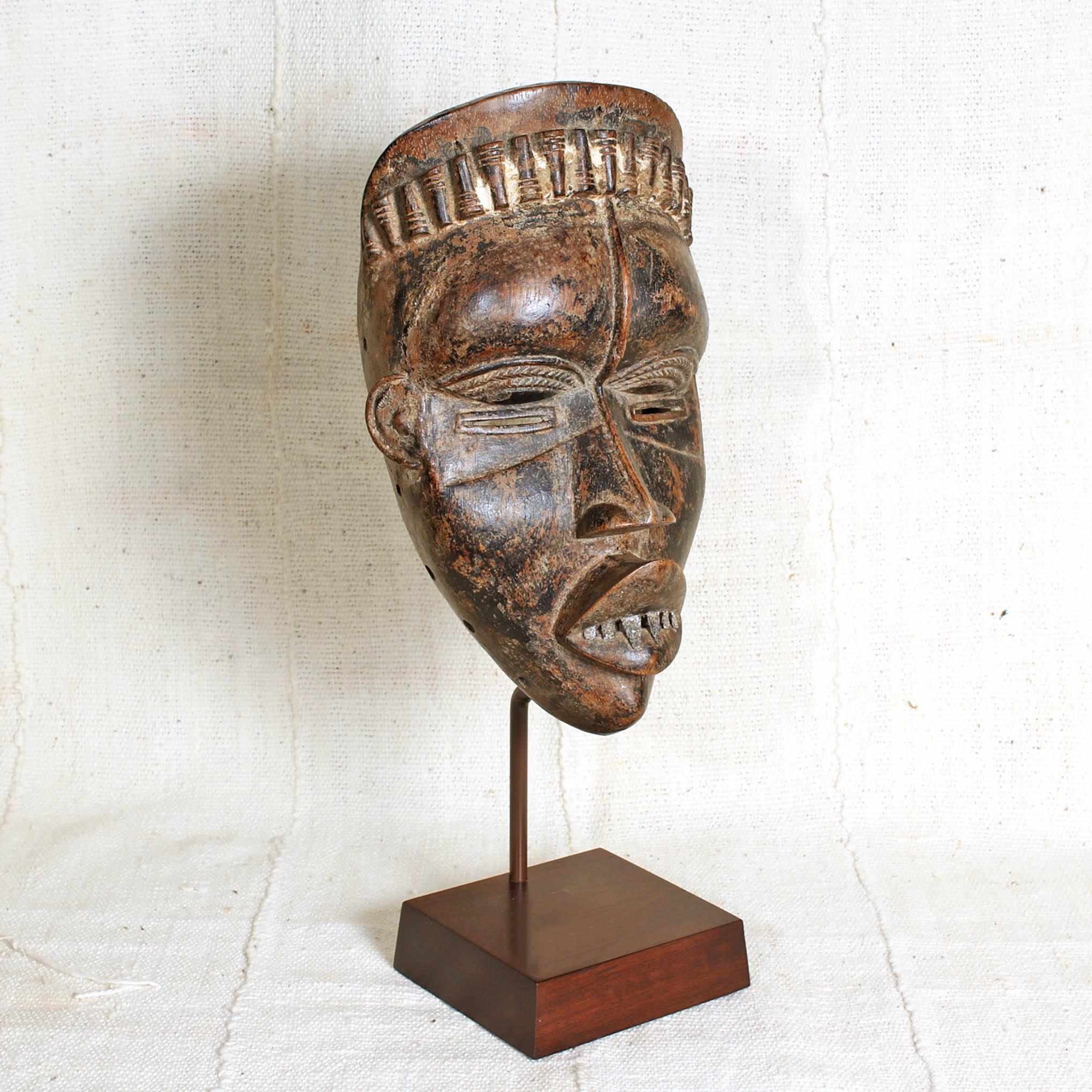 Bassa Mask from Liberia on a stand showing right side 